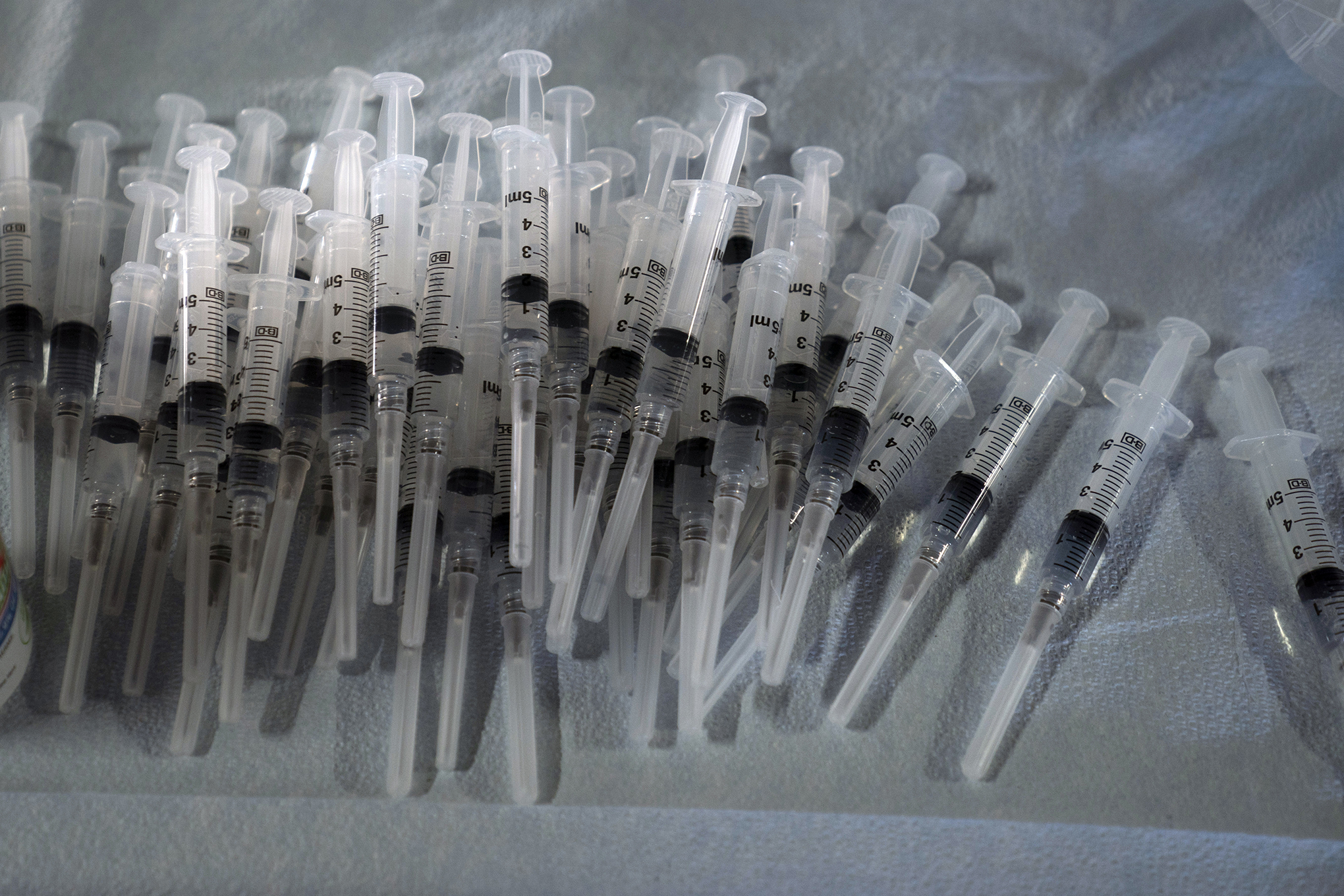 Syringes prepared with Pfizer's COVID-19 vaccine