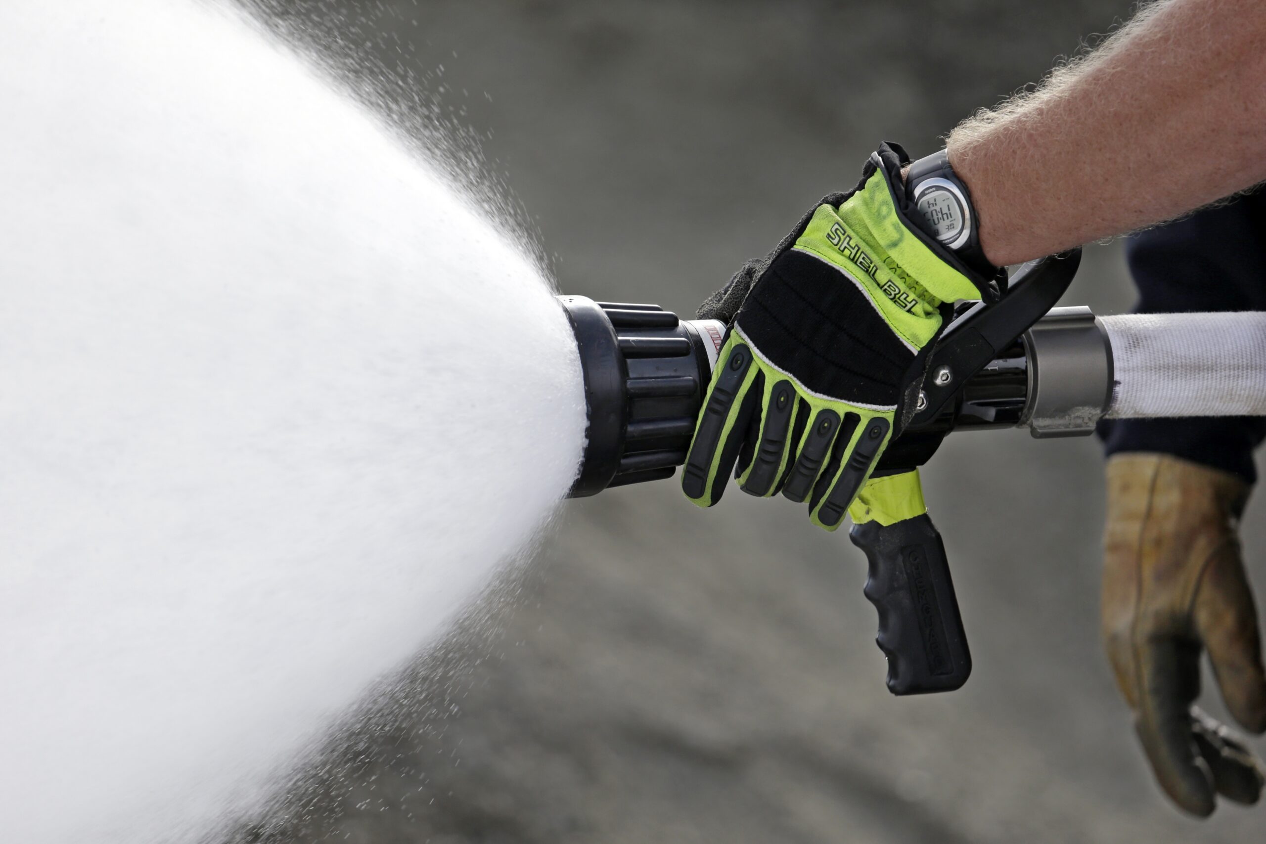 A Seattle firefighter sprays foam during a specialized training session