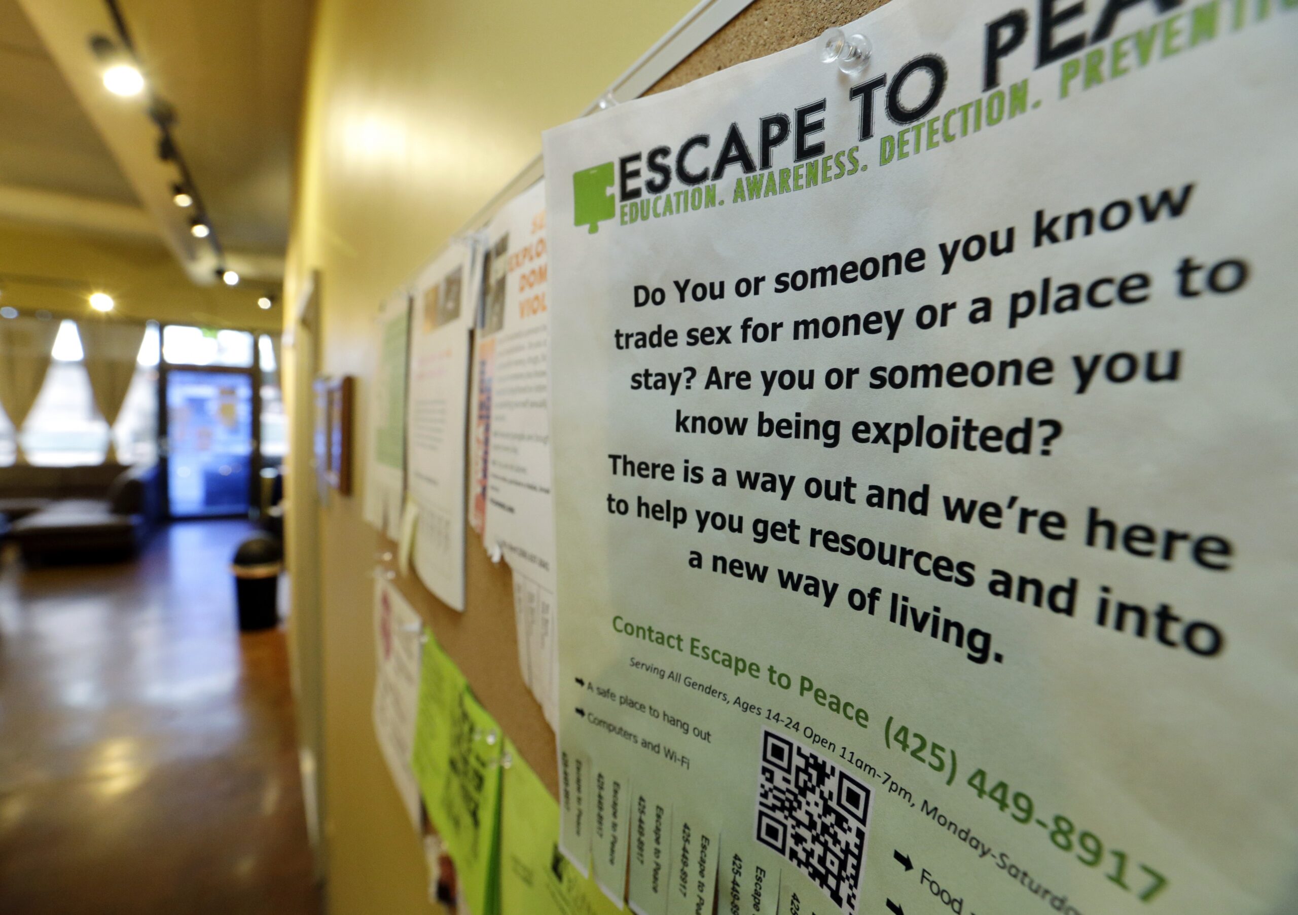 a poster on the wall advertising sex trafficking resources