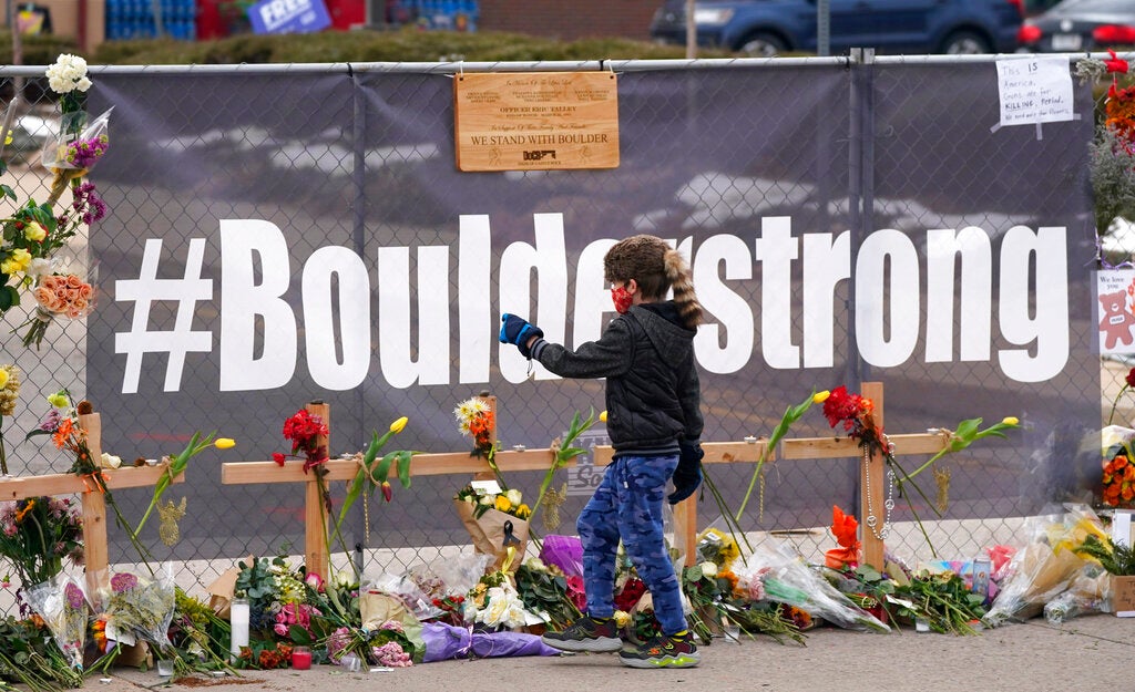 A fence near the scene of a grocery store shooting in Boulder, Colo.
