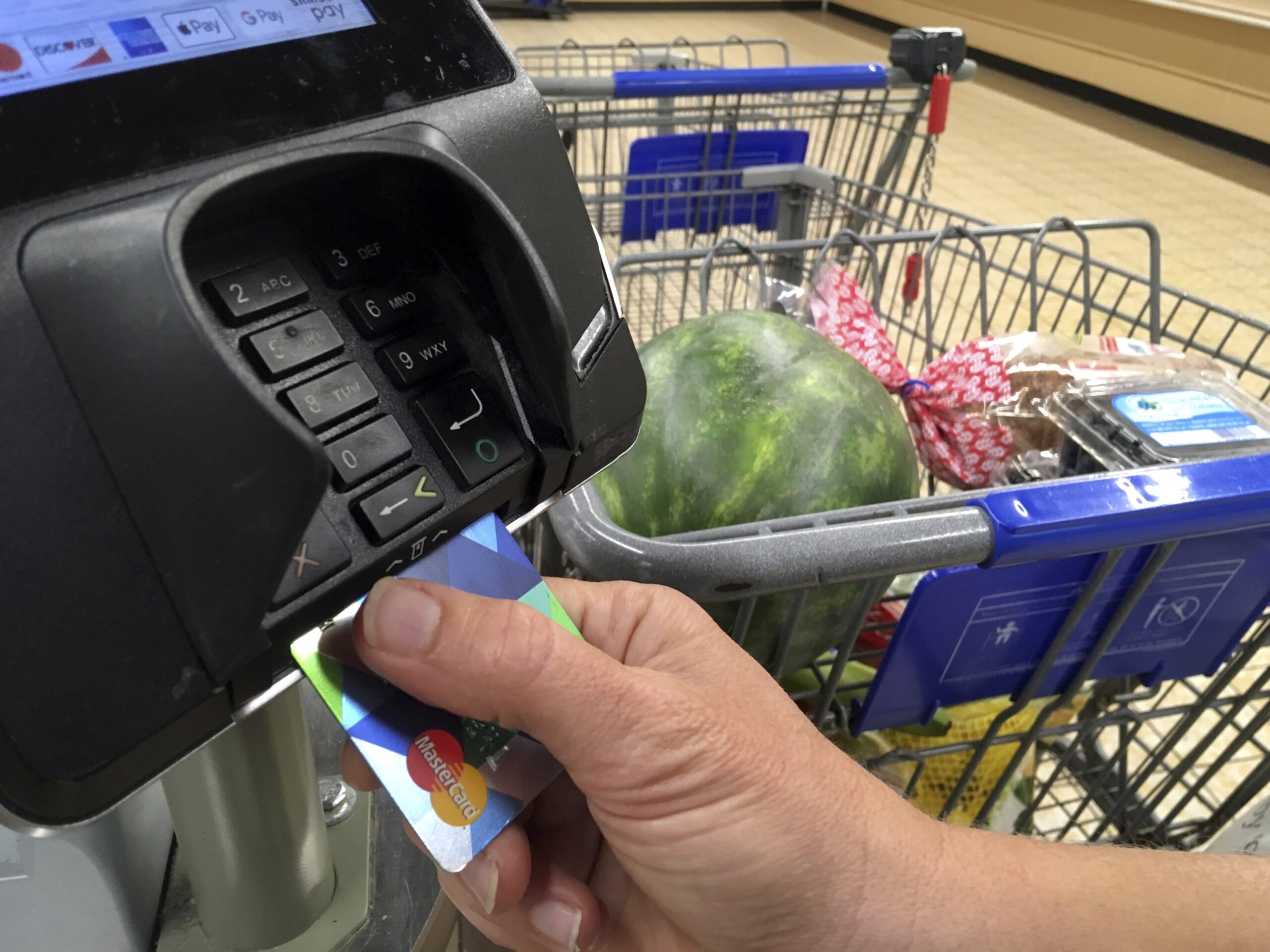 A customer buys groceries with a credit card