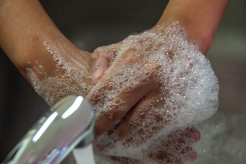 person washing their hands