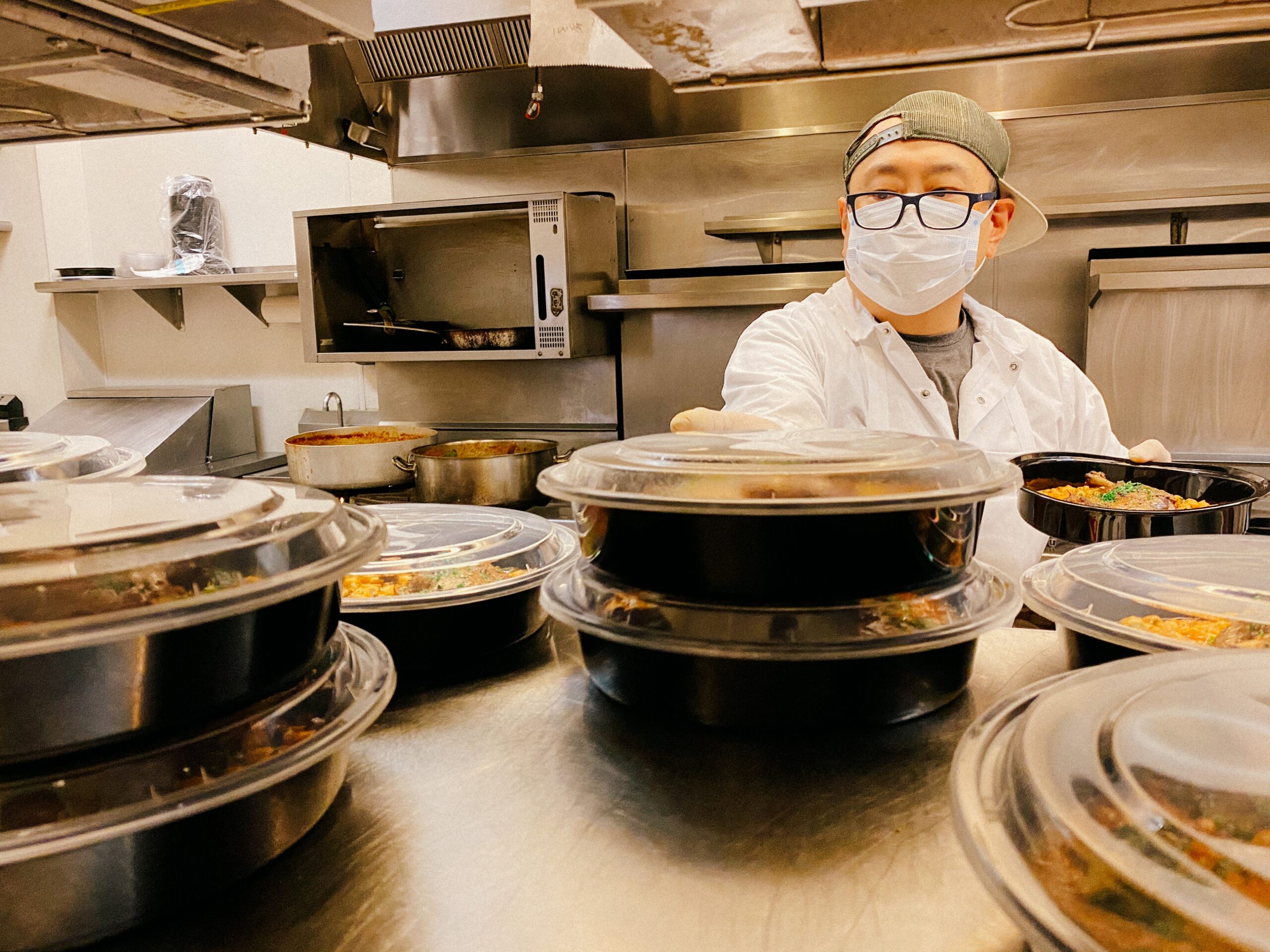 A chef preparing takeout orders during the pandemic