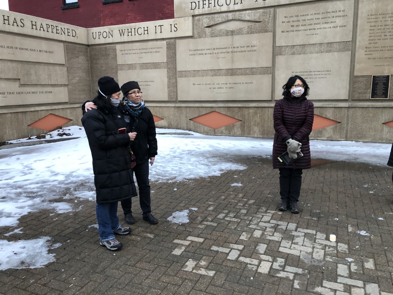 Julia Cheng Comforts Julie Kim At Twin Ports Rally Against Hate