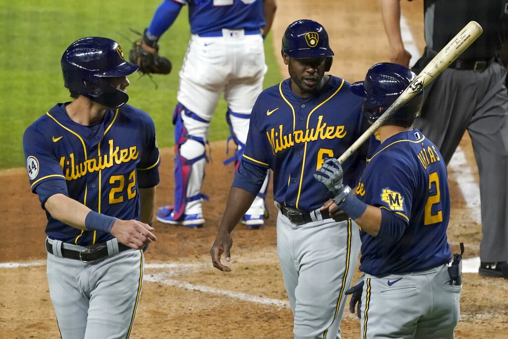 Christian Yelich, Lorenzo Cain and Luis Urias of the Milwaukee Brewers