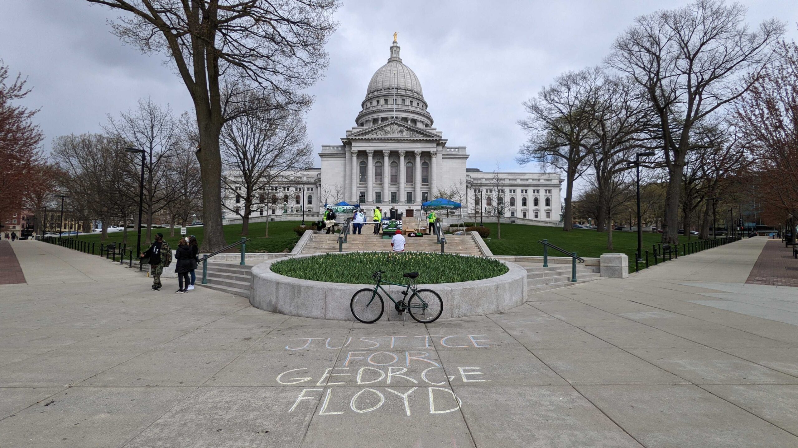"Justice for George Floyd' written on the sidewalk in chalk