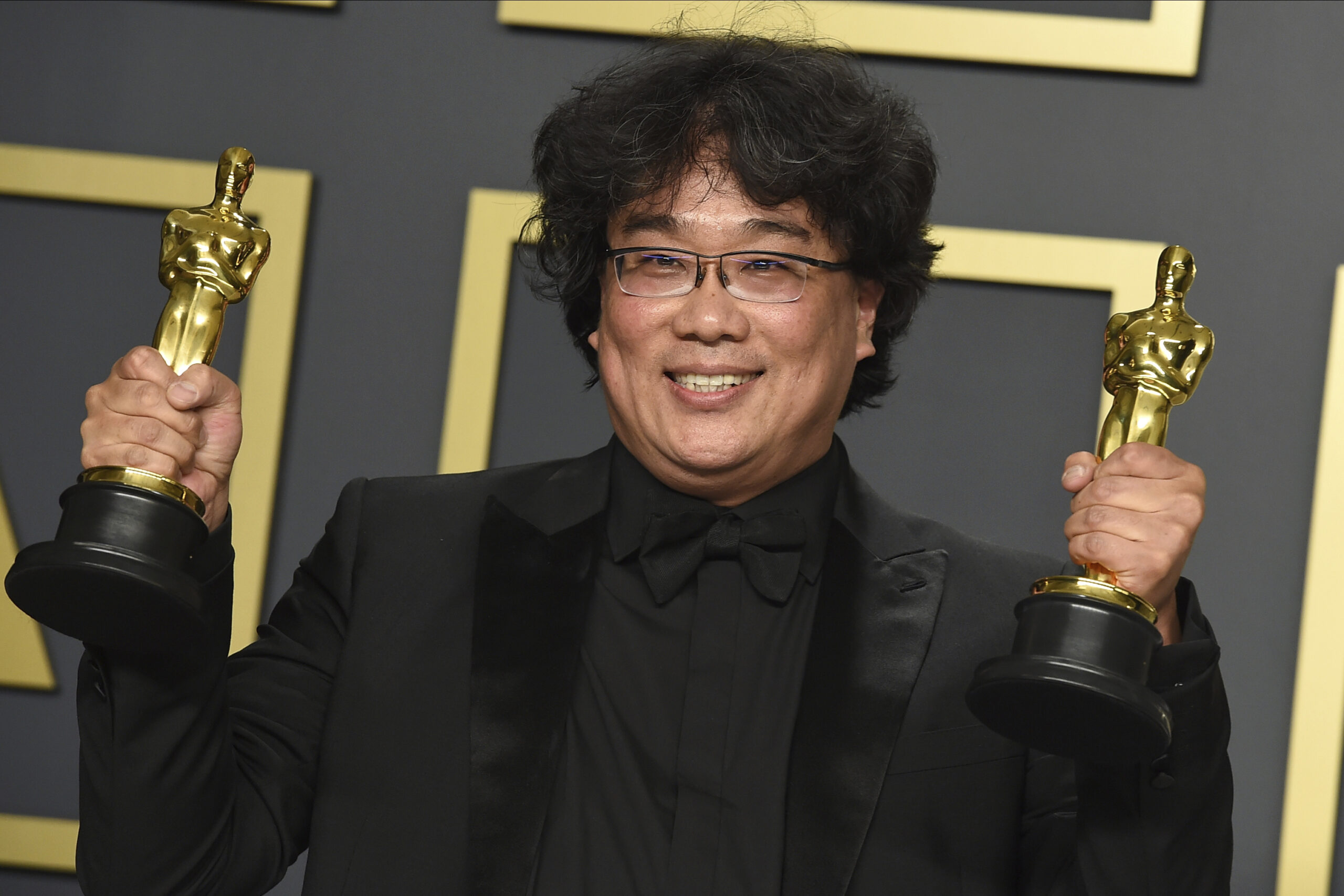 Director of "Parasite" Bong Joon Ho holding Oscar trophies