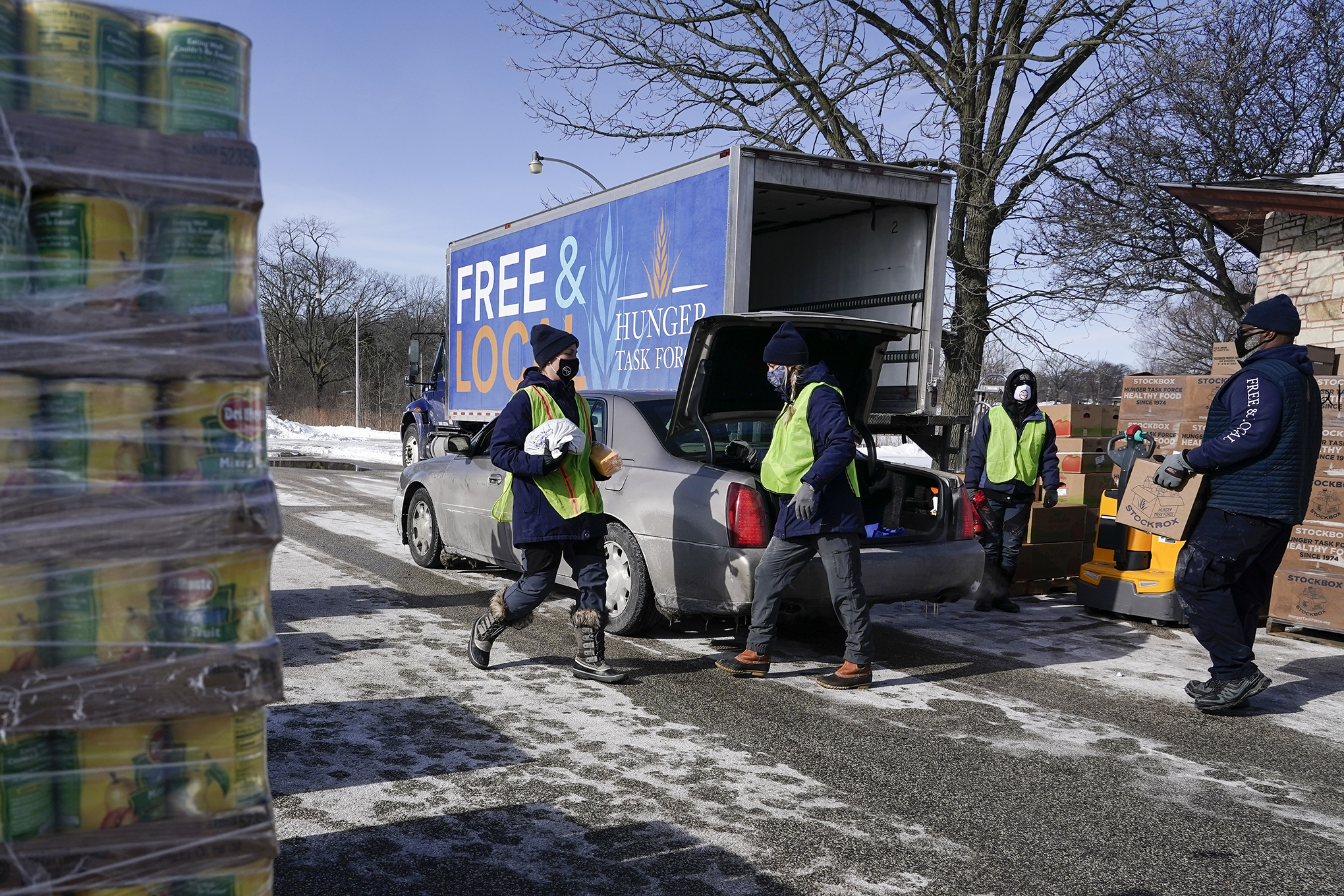 Hunger Task Force Workers distribute food at McGovern Park in Milwaukee