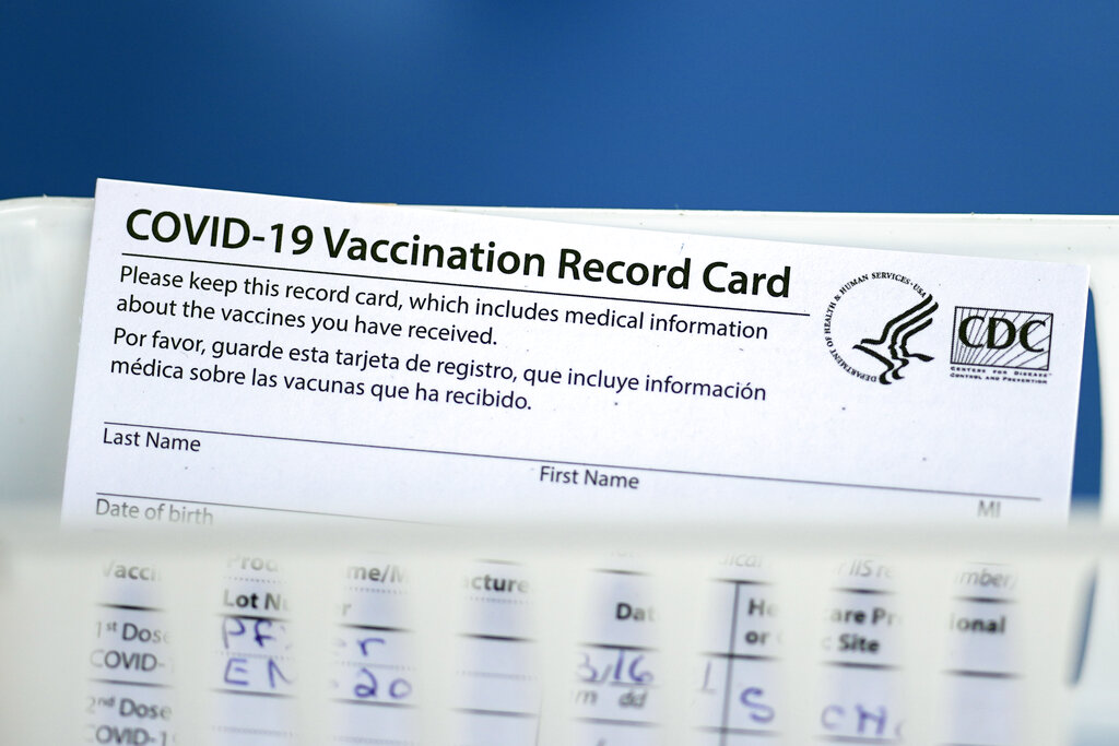 A COVID-19 vaccination record card