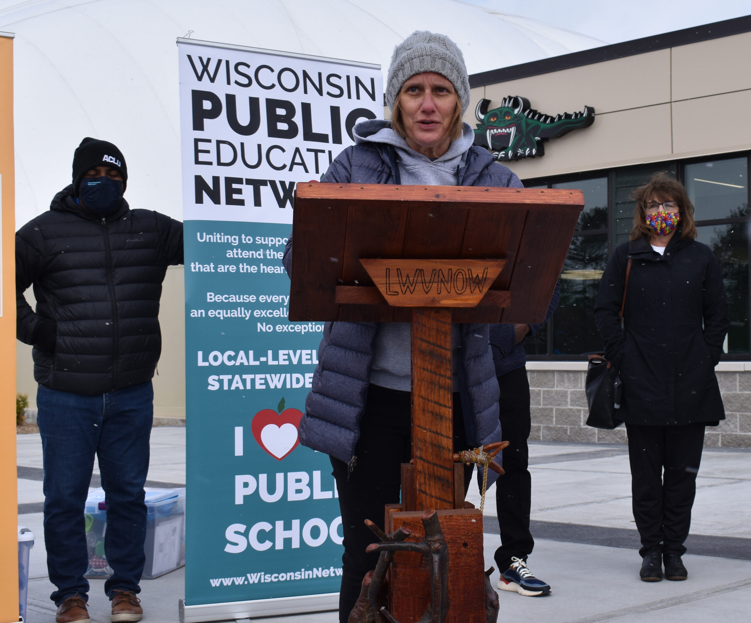 Heather DuBois Bourenane, executive director of the Wisconsin Public Education Network, speaks at a press conference outside the Joint Finance Committee's budget hearing in Rhinelander