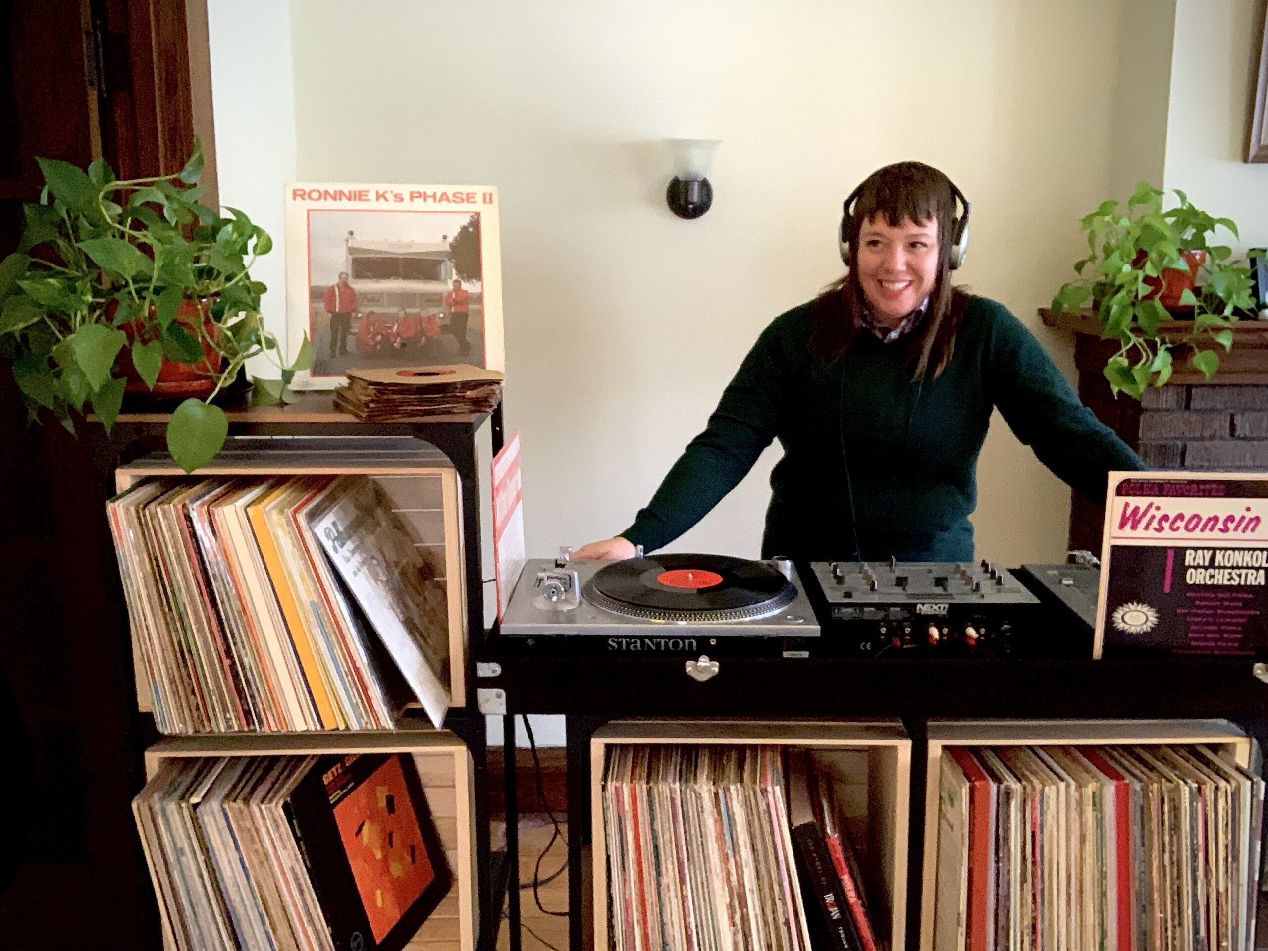 Stacy Harbaugh poses with vinyl polka records