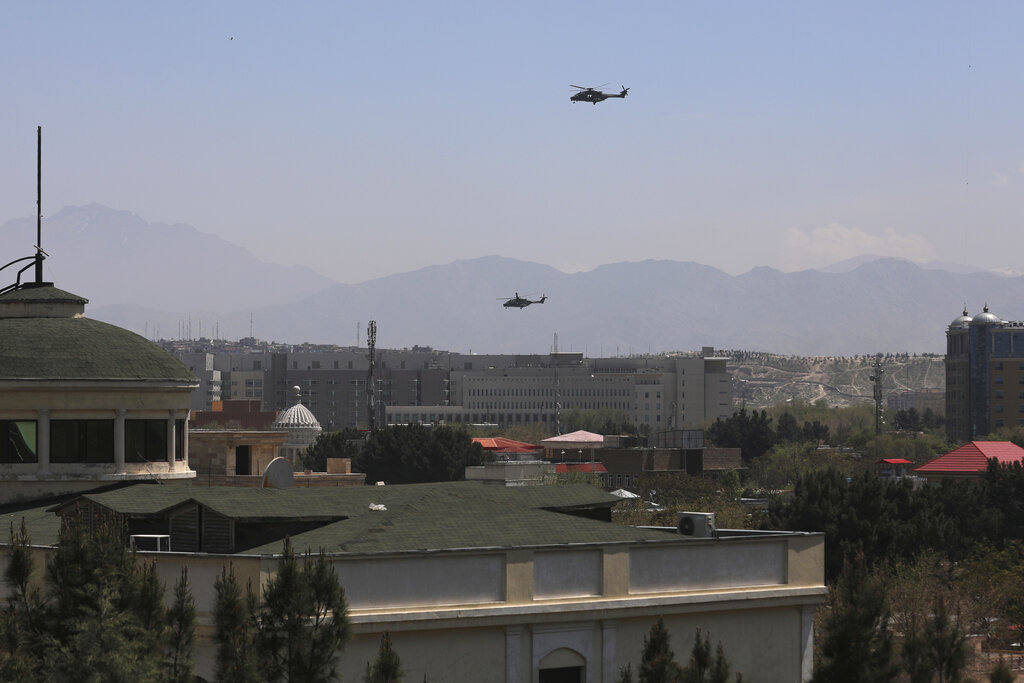 U.S. Black Hawk military helicopters fly over the city of Kabul, Afghanistan