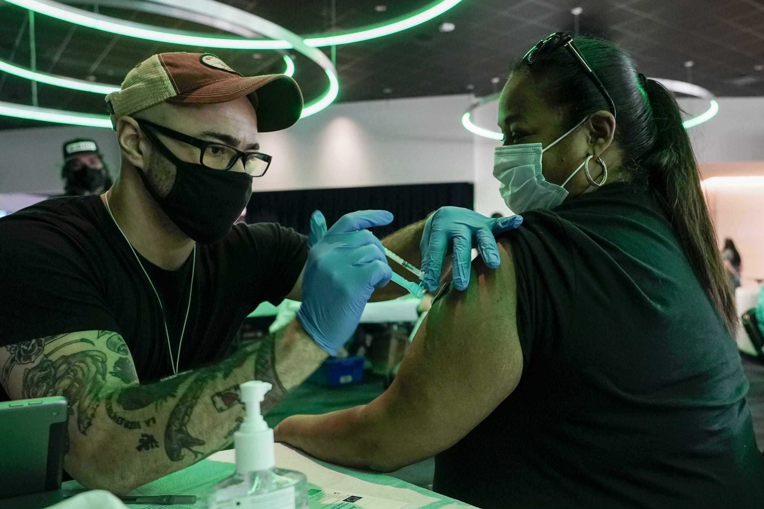 A fan gets a vaccine at at Milwaukee Bucks game