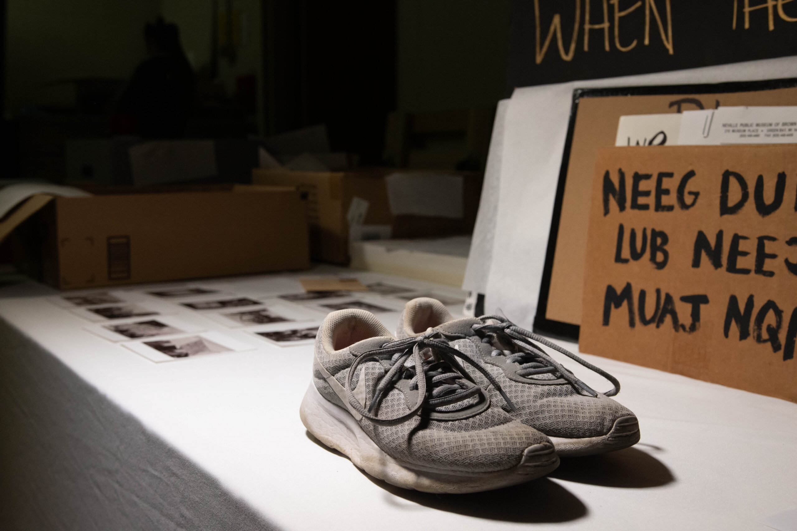 Items for processing at the Neville Public Museum in Green Bay include sneakers work at a 2020 protest
