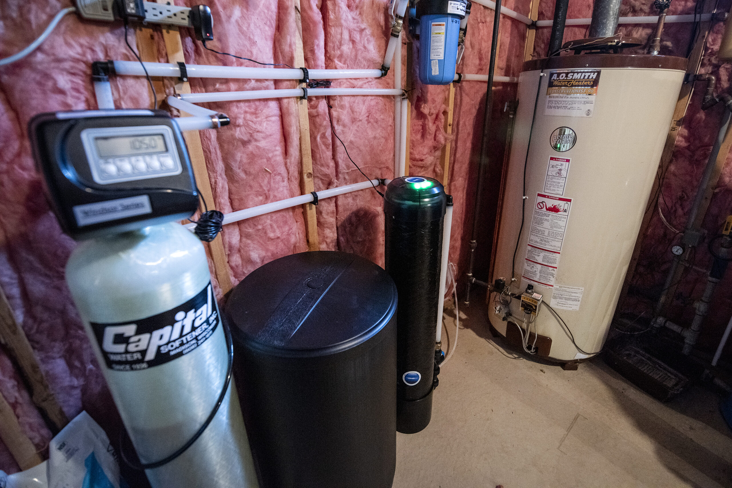 Filter systems and water softeners are in a basement.