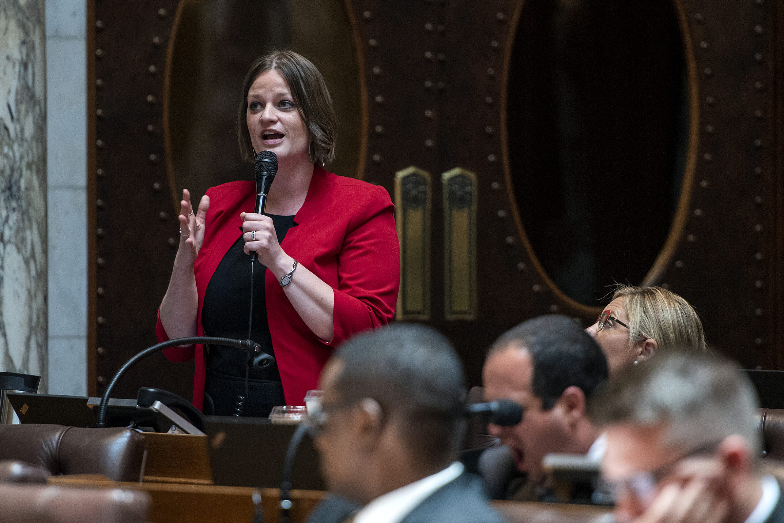 Rep. Katrina Shankland speaks into a microphone.