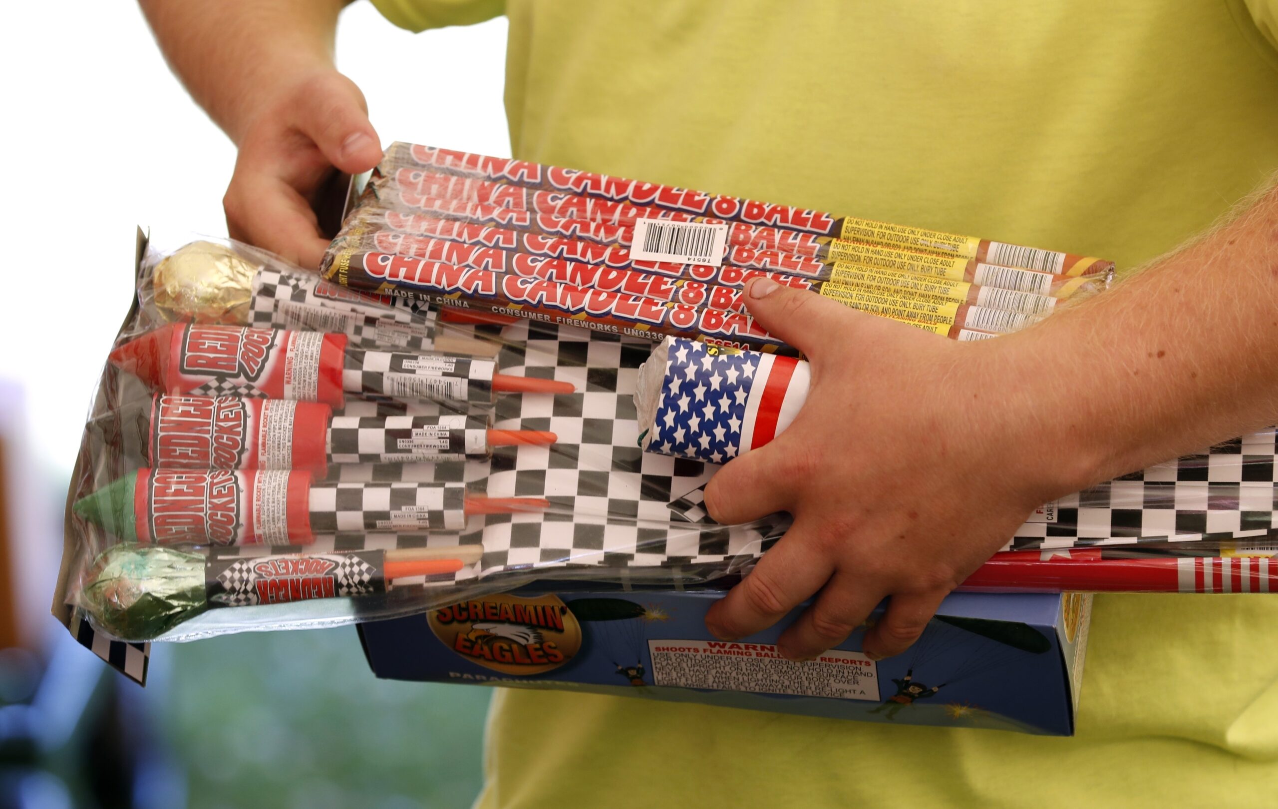 Julian Gibson, of Dallas Center, Iowa, holds packages of fireworks