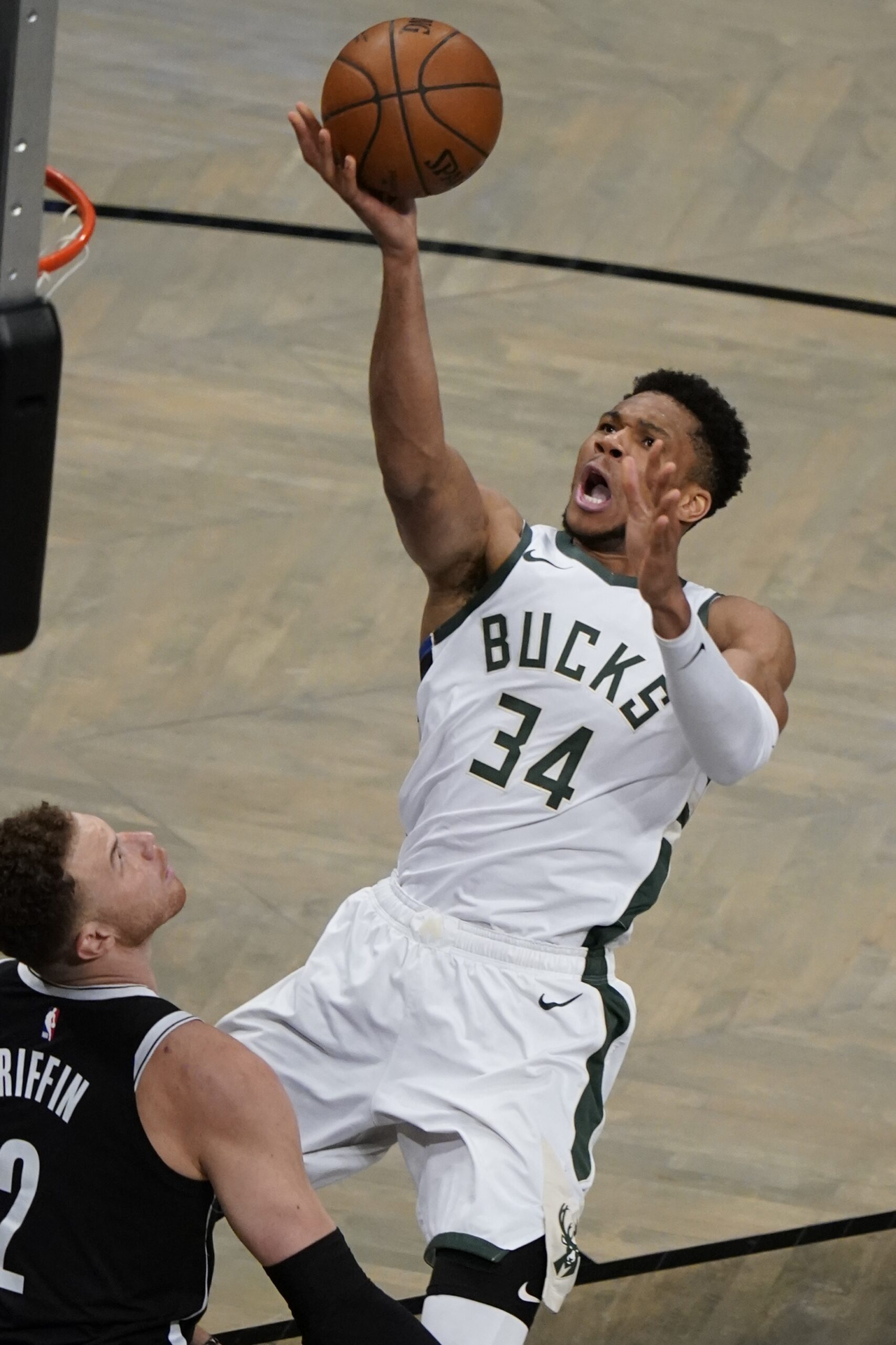 Giannis Antetokounmpo shoots during a playoff game against the Brooklyn Nets