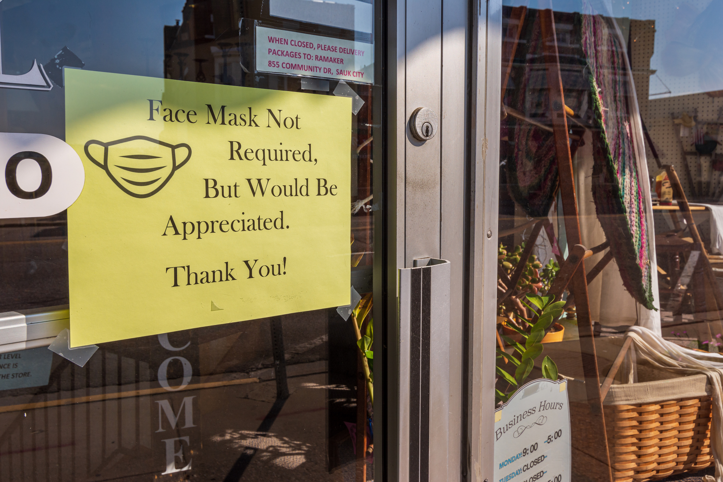 "Face mask not required" sign at a business in Sauk City, Wis.
