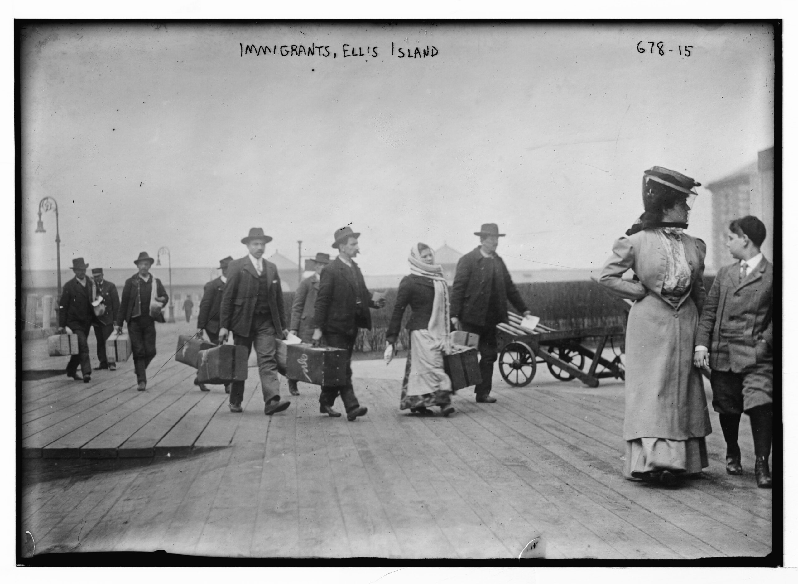 Immigrants Carrying Luggage on Ellis Island