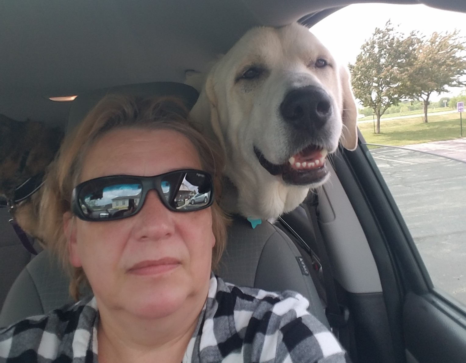Linda Ledbeter poses with Oliver, a Dogs2DogTags rescue