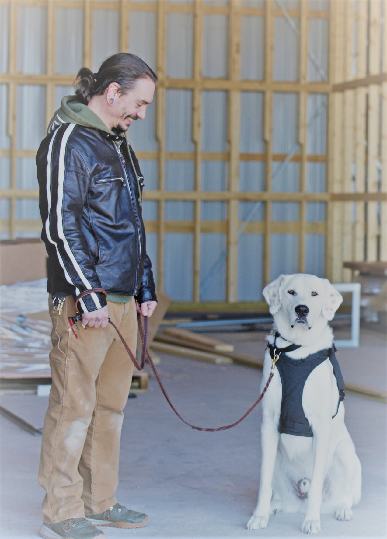 Ric Daus poses with his dog, Patton