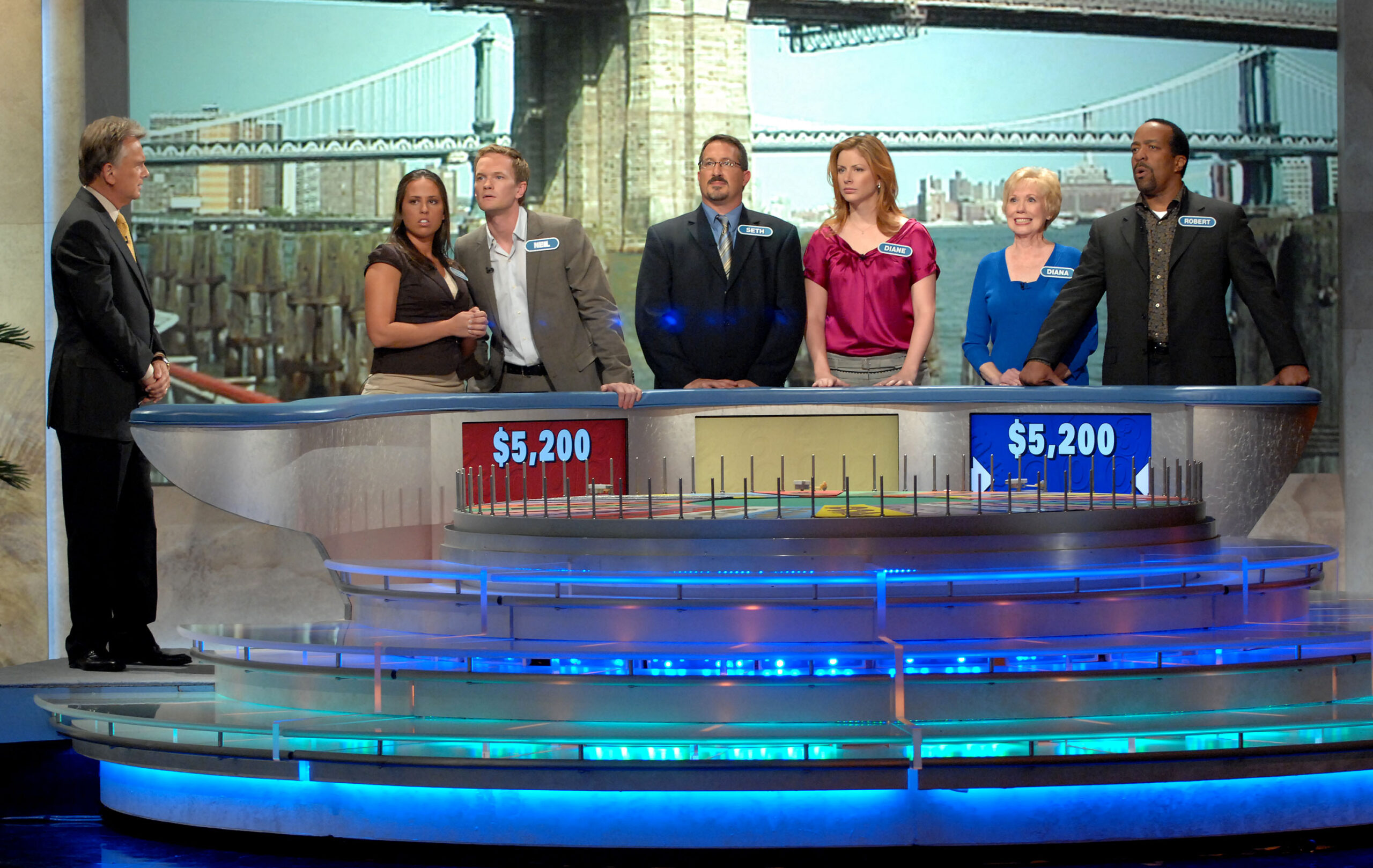 Wheel of Fortune host and contestants