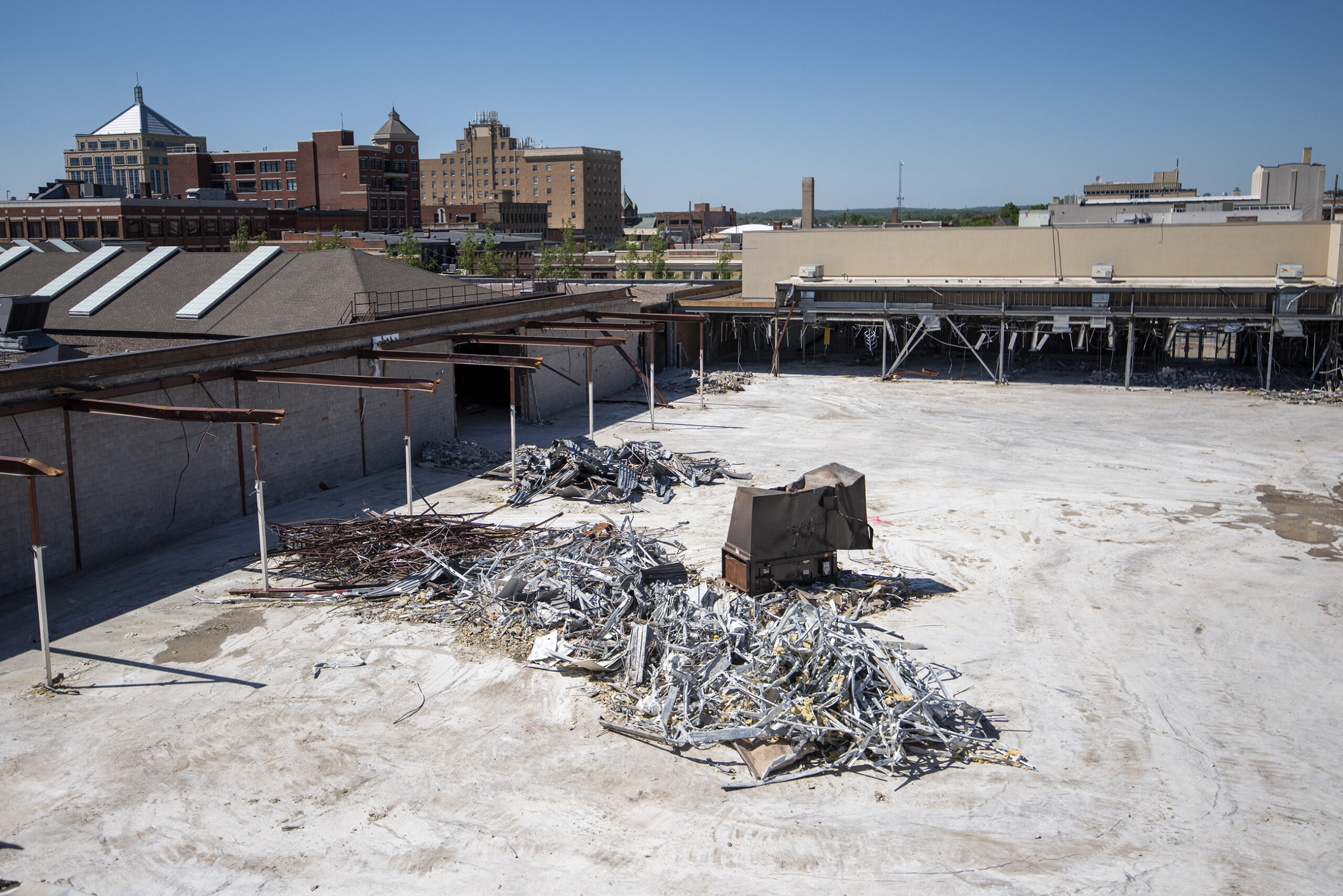 From above, a section of the former mall is completely demolished with only rubble remaining.