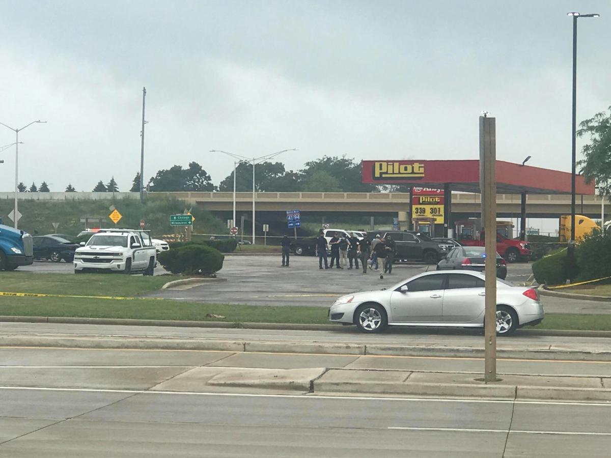 Law enforcement officials from Racine and Caledonia occupy the Pilot Travel Center parking
