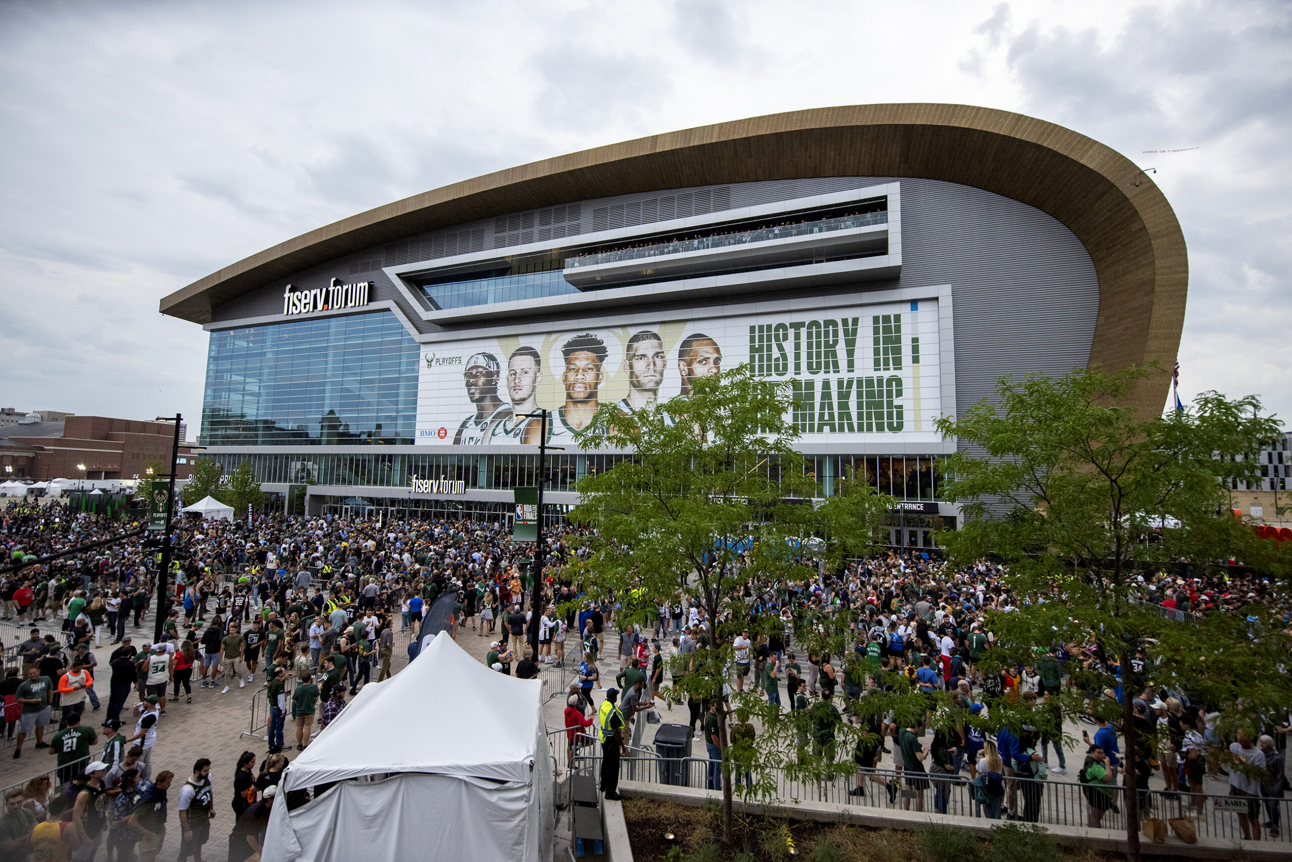 A sea of fans can be seen in front of the FIserv Forum.