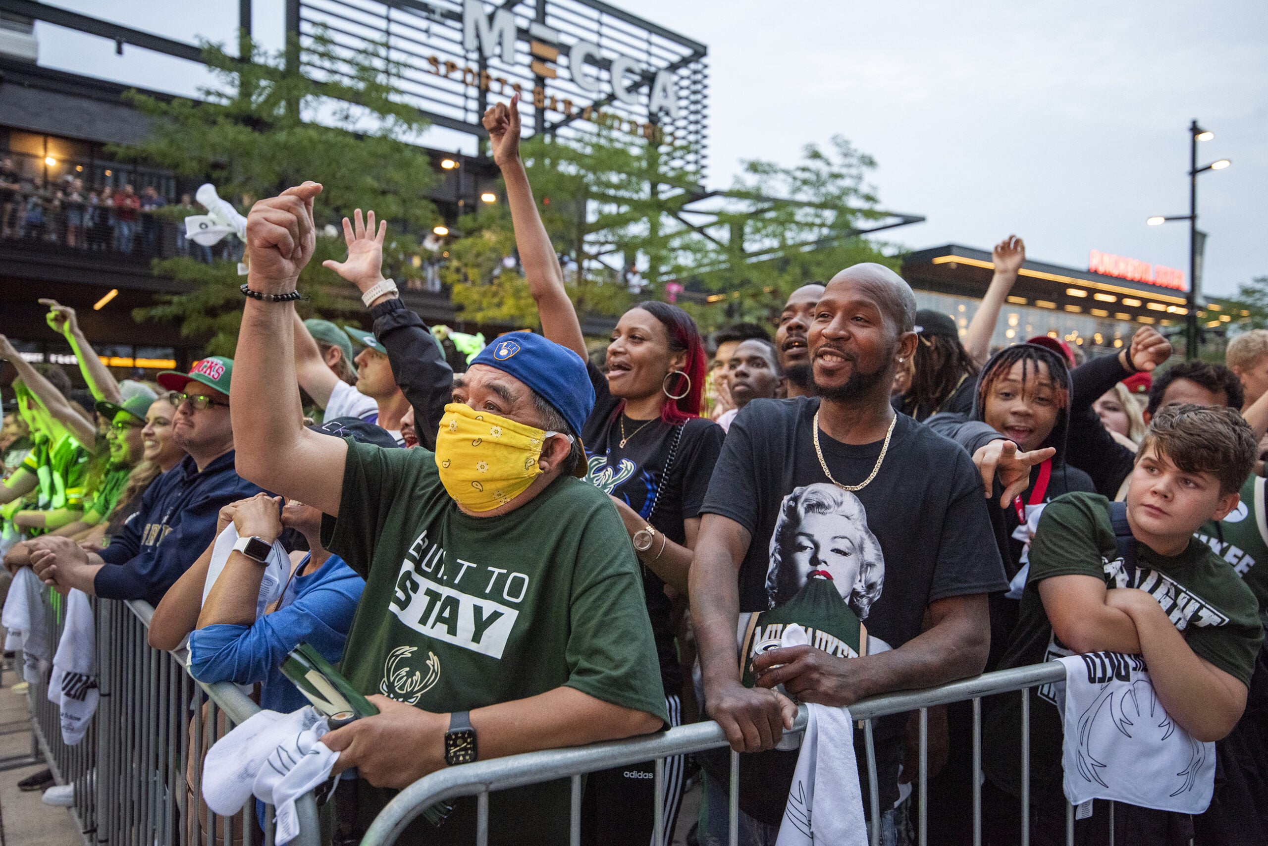 Fans cheer in a crowd in the Deer District.