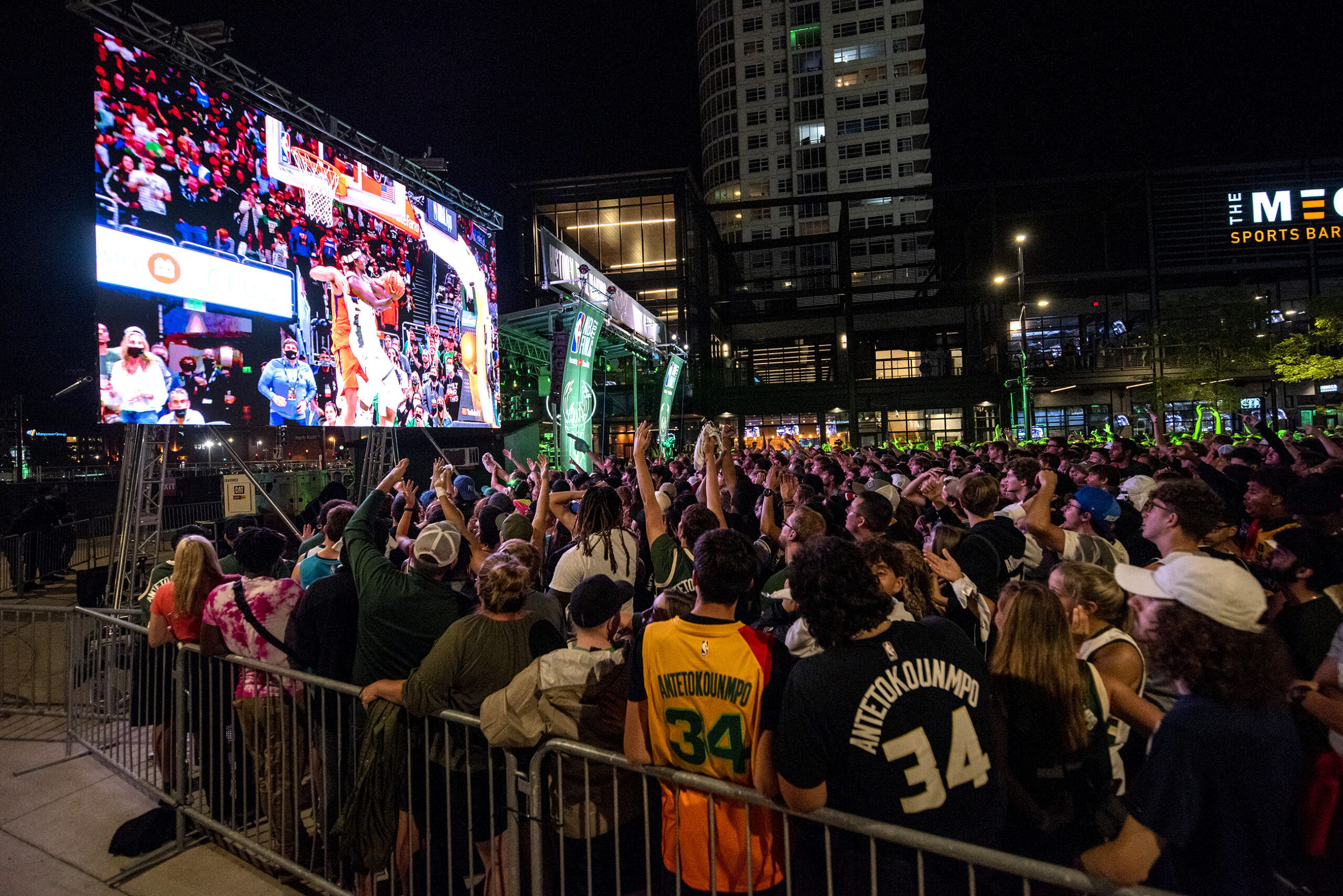 A crowd of fans gather to watch the game in the Deer District.