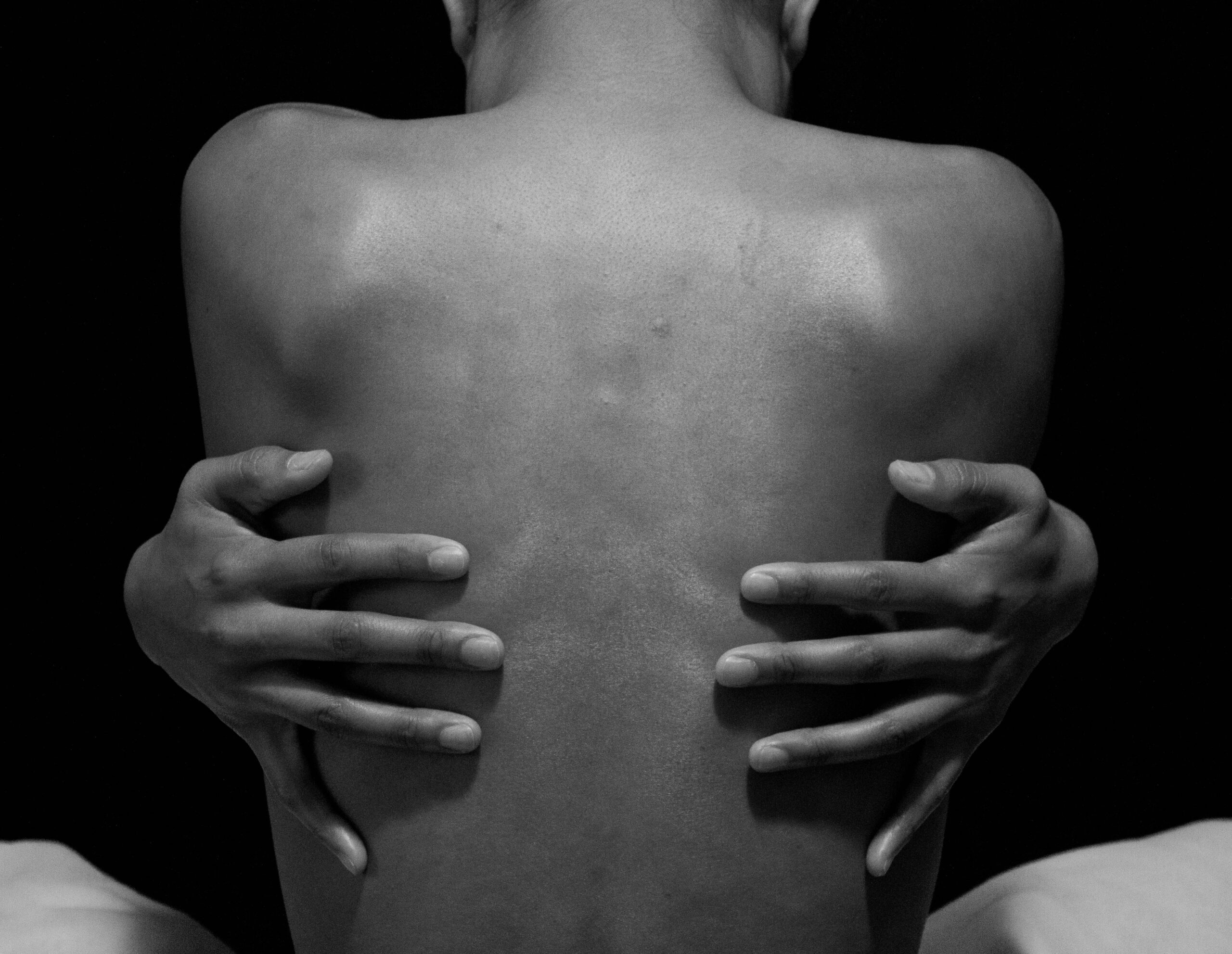 A woman with her back turned.