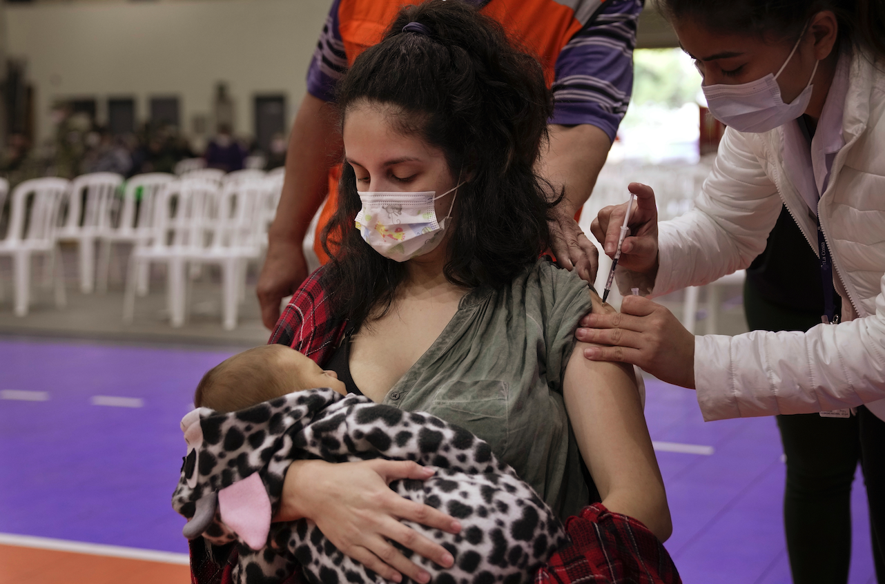 Vannia Valdez breastfeeds her one-month-old son Mateo