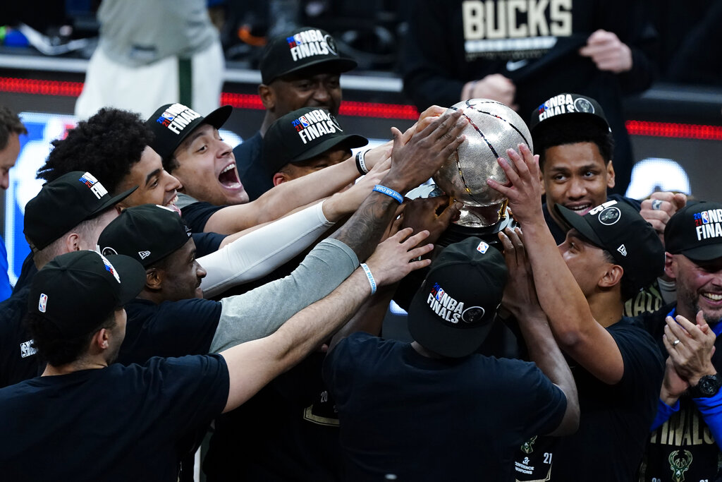 The Milwaukee Bucks hoist the trophy