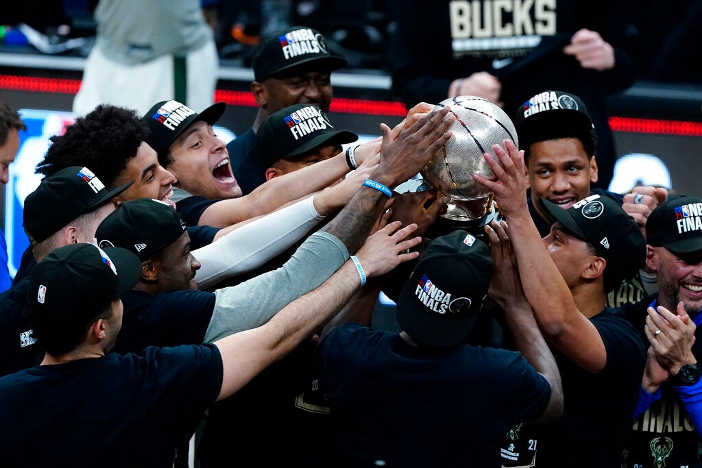 The Milwaukee Bucks hoist the trophy