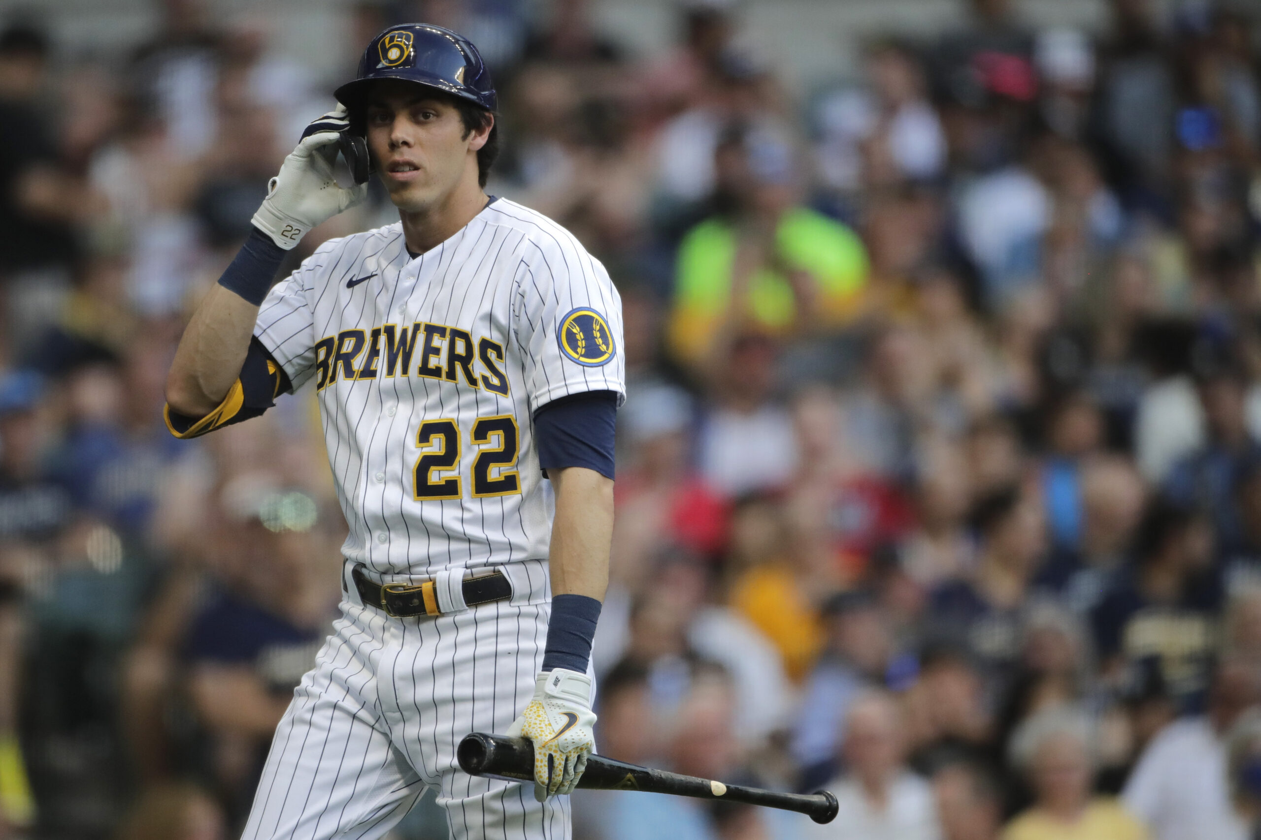Milwaukee Brewers' Christian Yelich walks back to the dugout