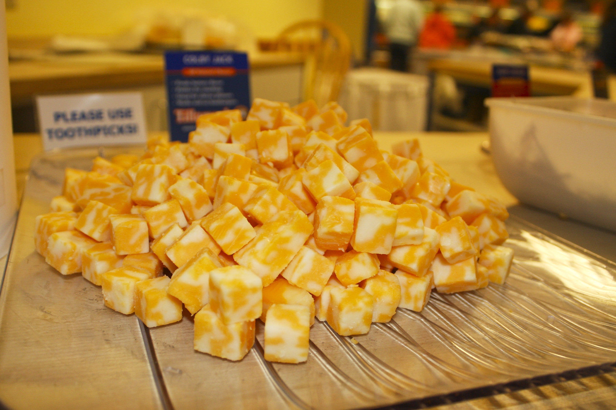 cubes of yellow cheese on a plate