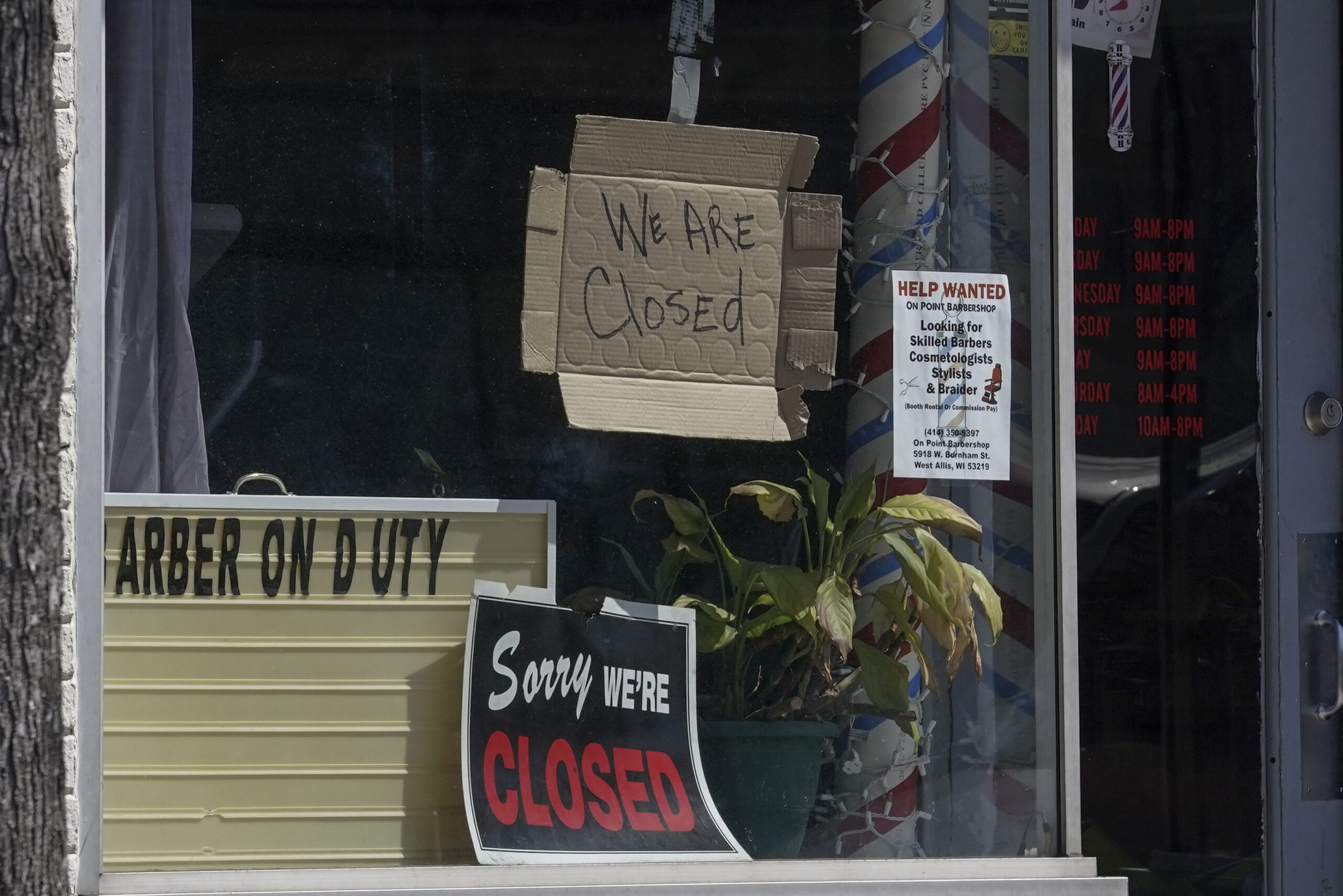 Closed signs in Milwaukee storefront