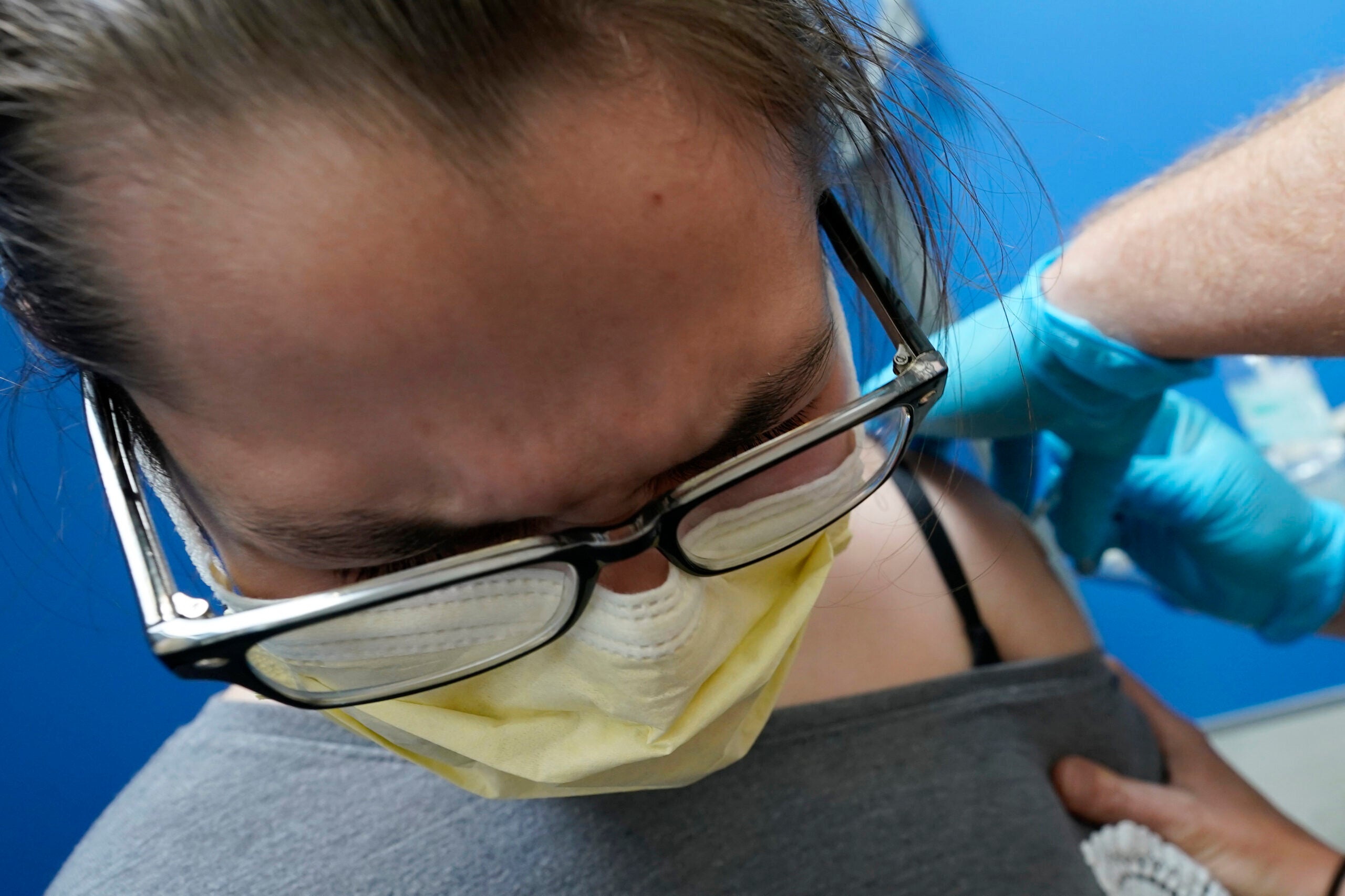 Thirteen-year-old Bryleigh Roop gets his first dose of the Pfizer COVID-19 vaccine