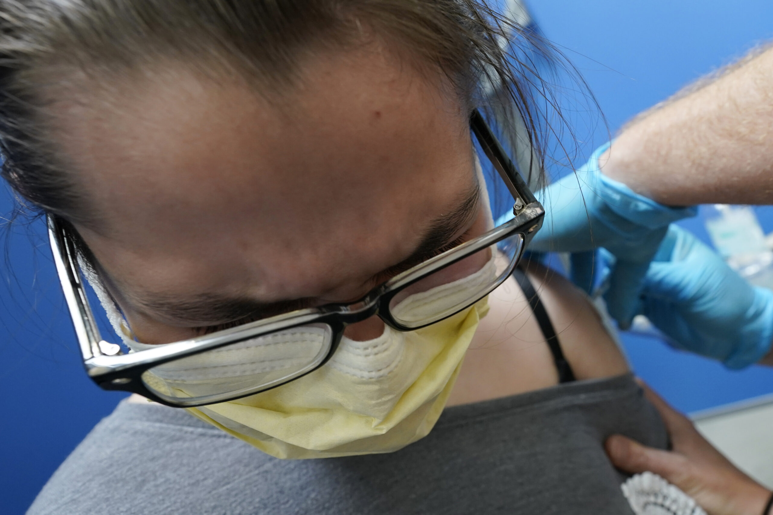 Thirteen-year-old Bryleigh Roop gets his first dose of the Pfizer COVID-19 vaccine
