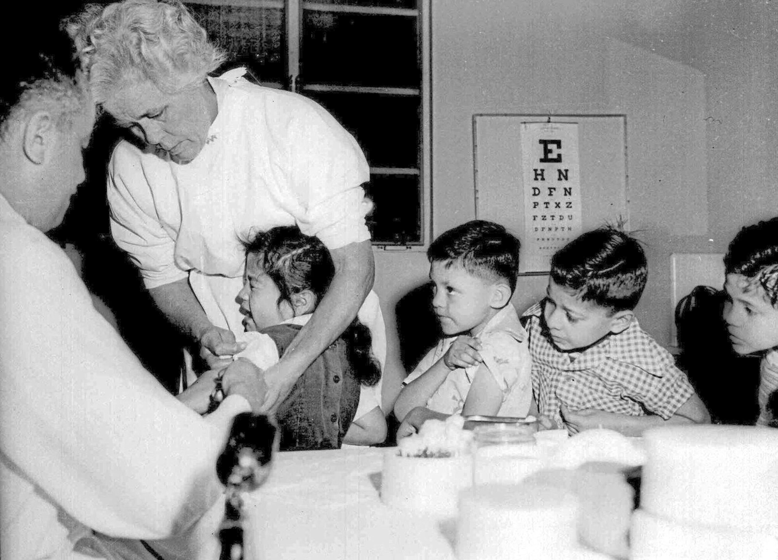 In this April 1955 photo, first and second-graders at St. Vibiana's school are inoculated against polio