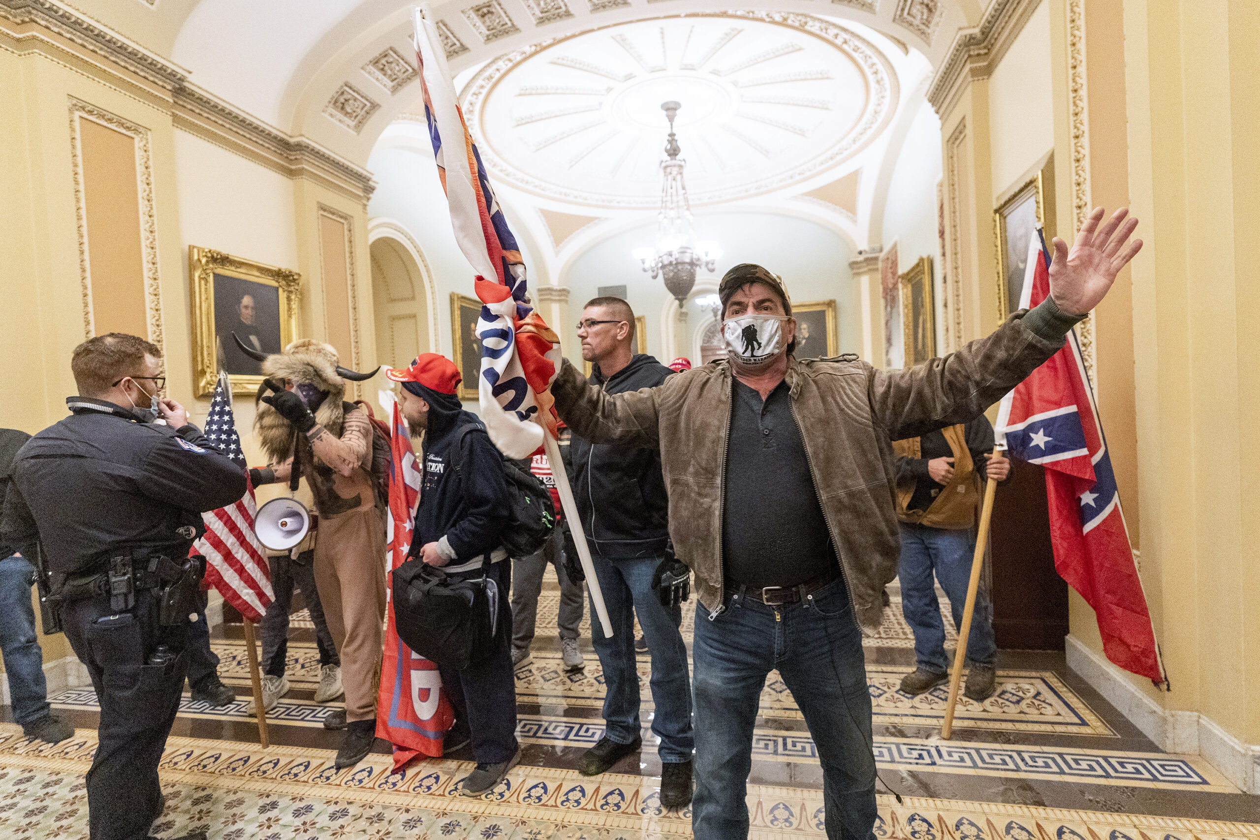 supporters of President Donald Trump are confronted by U.S. Capitol Police officers outside the Senate Chamber