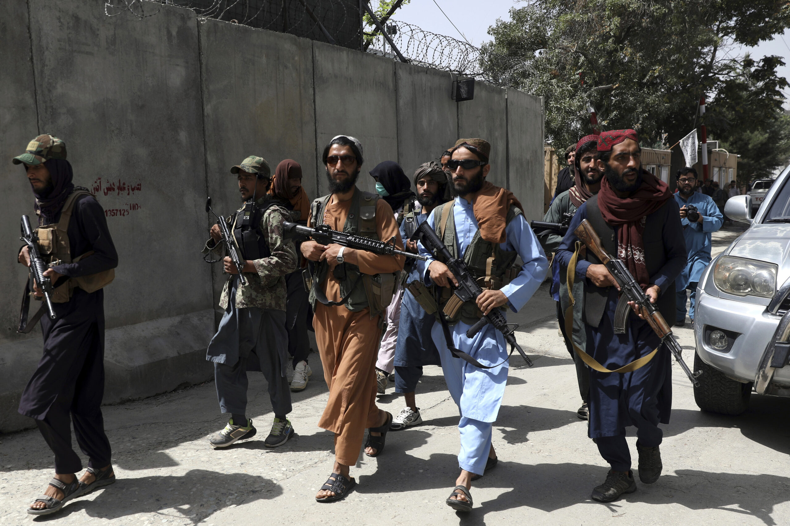 Taliban fighters patrol a neighborhood in the city of Kabul, Afghanistan
