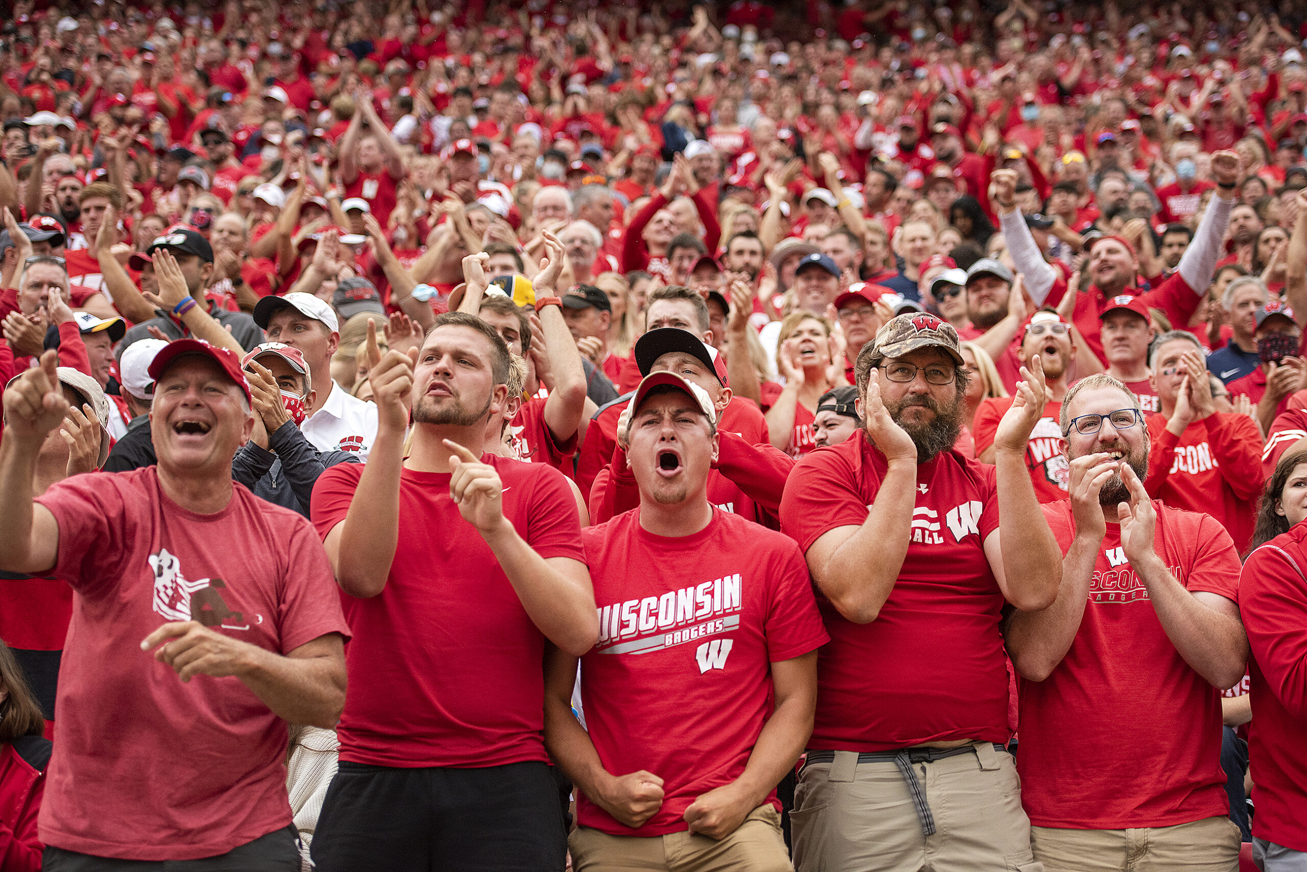 Wisconsin fans react with jubilation in the stands.