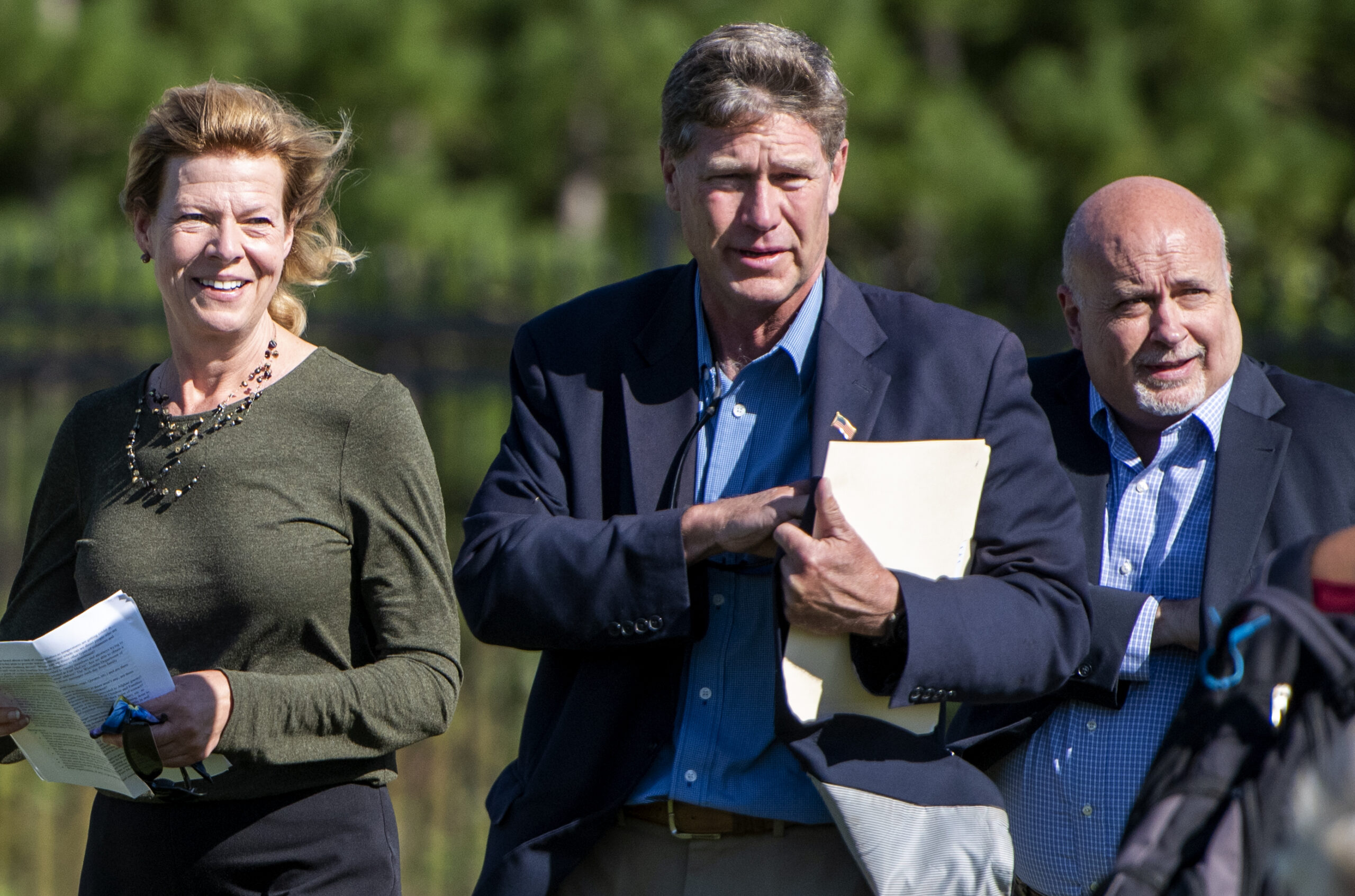 Sen. Baldwin, Rep. Kind and Rep. Pocan approach an outdoor press conference