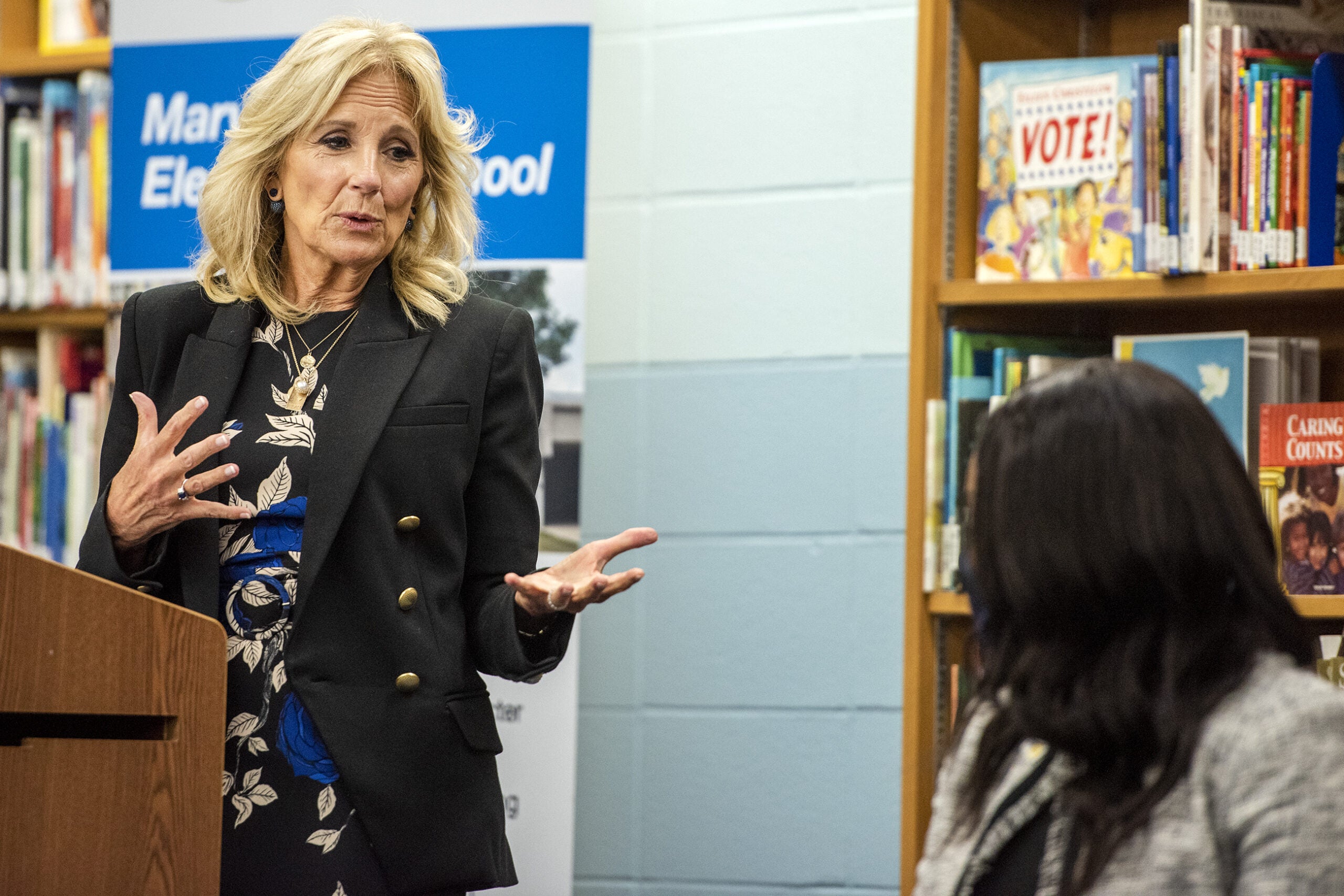 Jill Biden speaks at a podium.