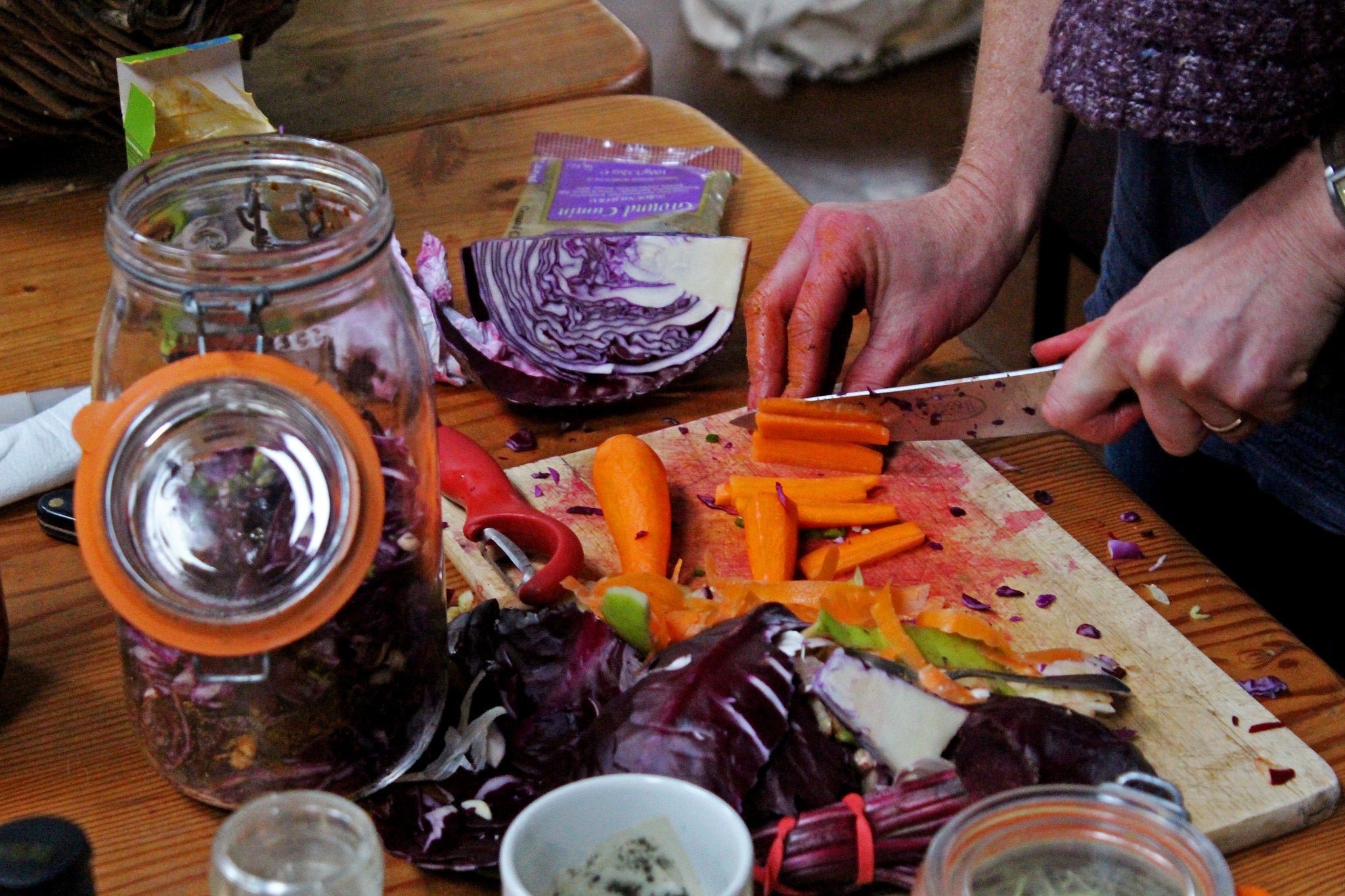 Cutting vegetables for fermentation.