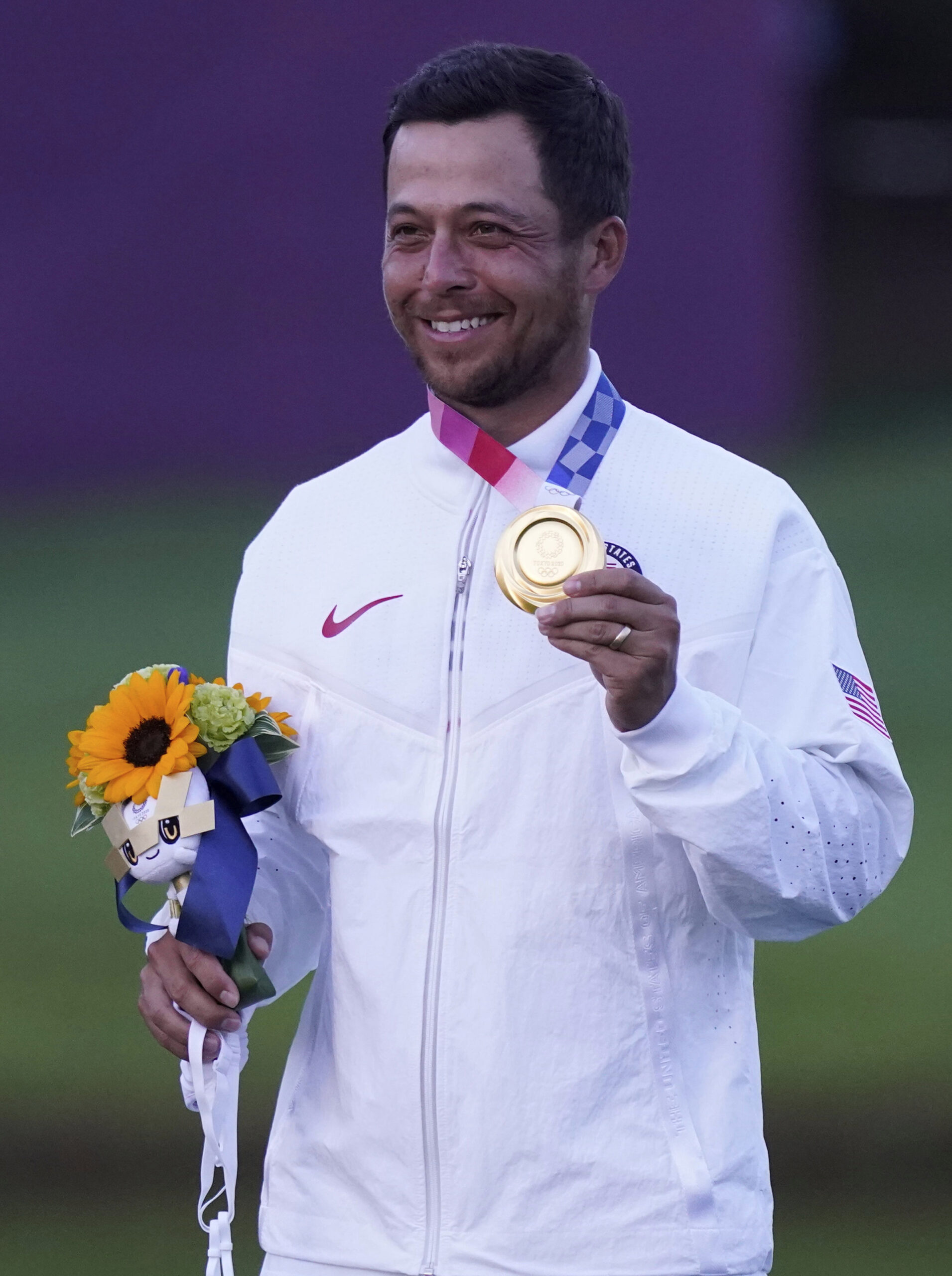 Xander Schauffele of the United States celebrates winning Gold in the Men's Golf event at the 2020 Summer Olympics