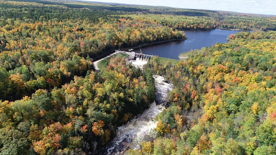 Breakwater Falls (Pine River Flowage) and the Pine River Dam during the peak of fall color.